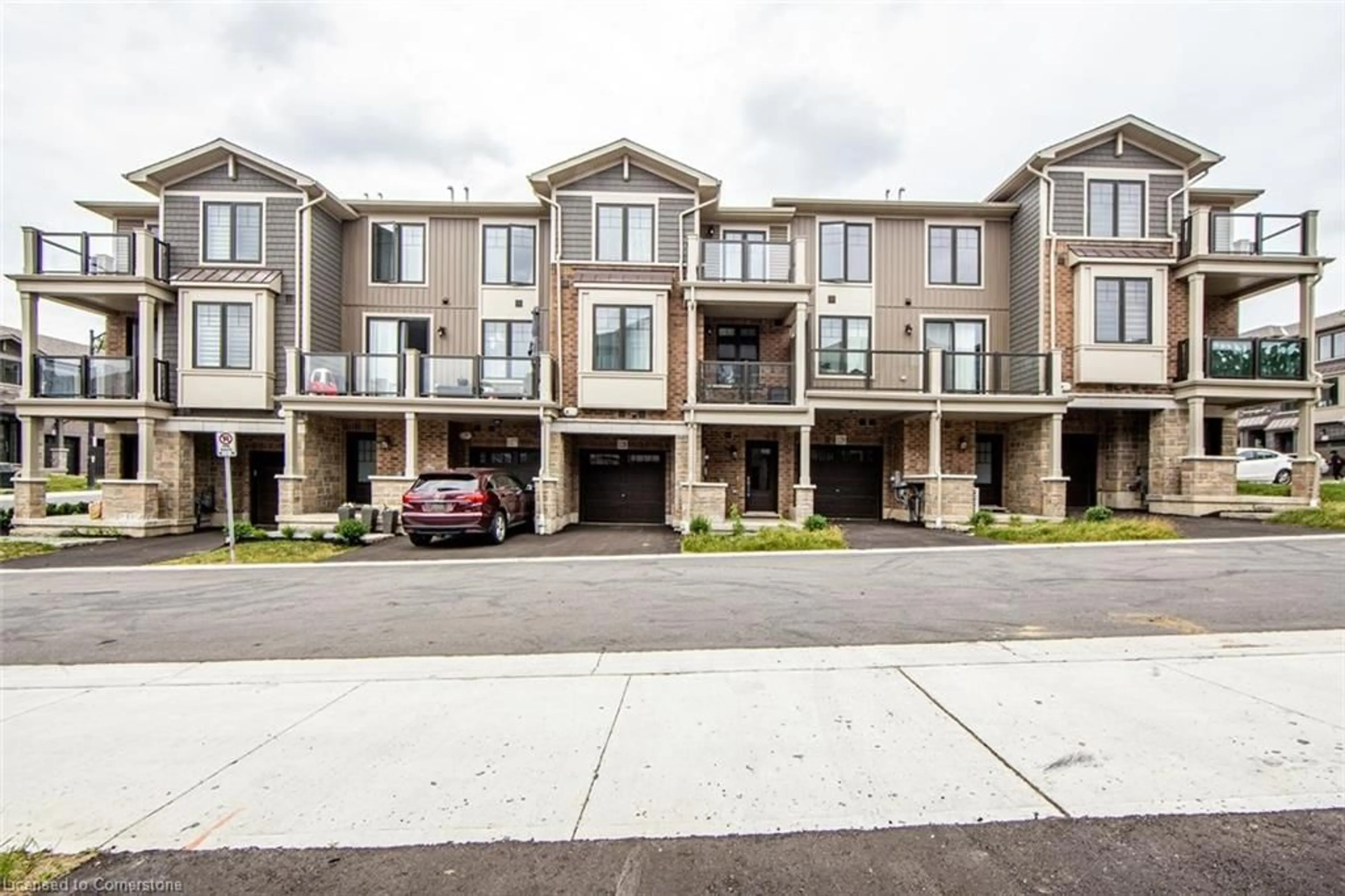 A pic from outside/outdoor area/front of a property/back of a property/a pic from drone, street for 10 Birmingham Drive Dr #128, Cambridge Ontario N1R 0C6