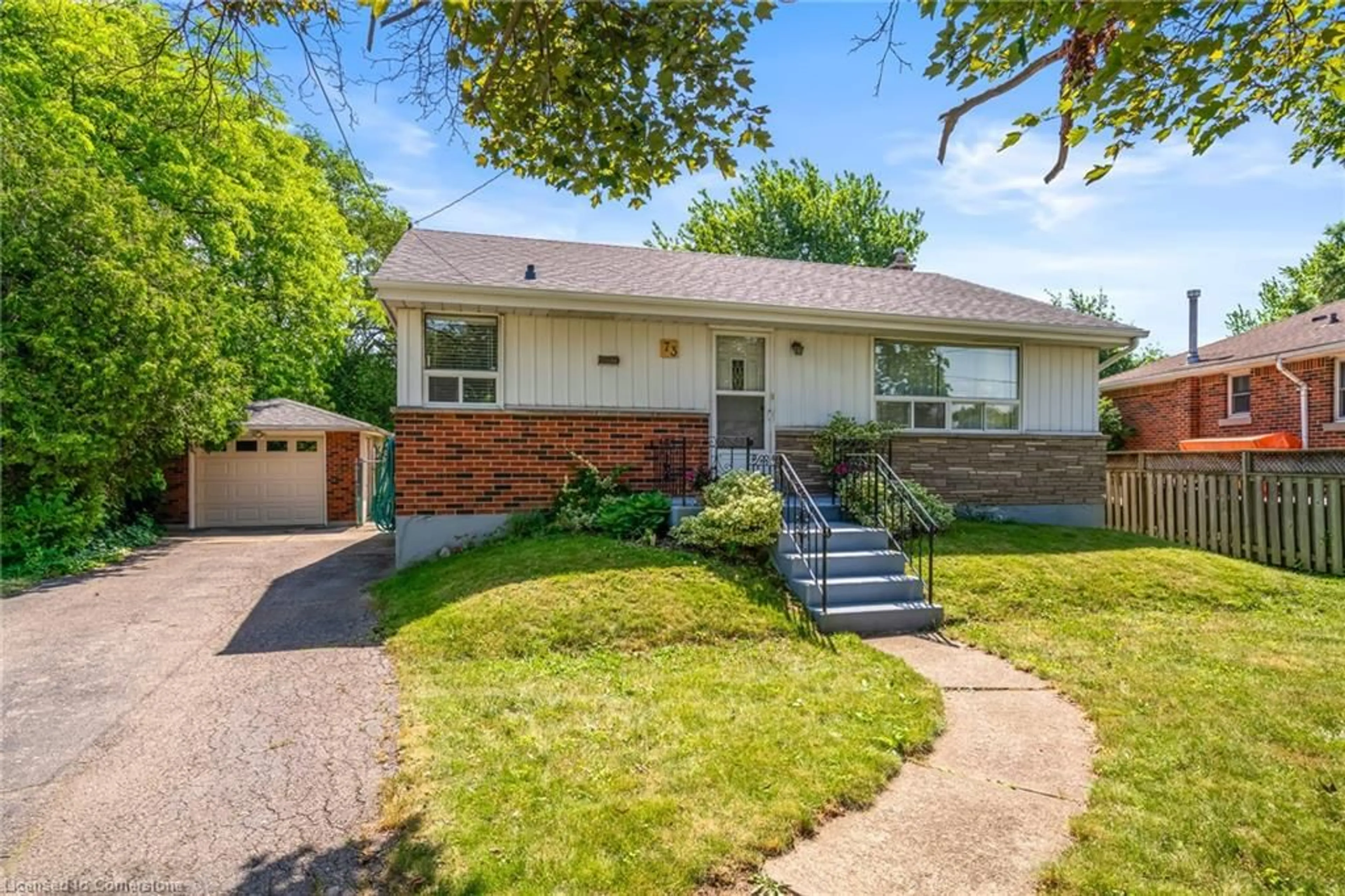 Home with brick exterior material, street for 73 Welbourn Dr, Hamilton Ontario L9A 3N5