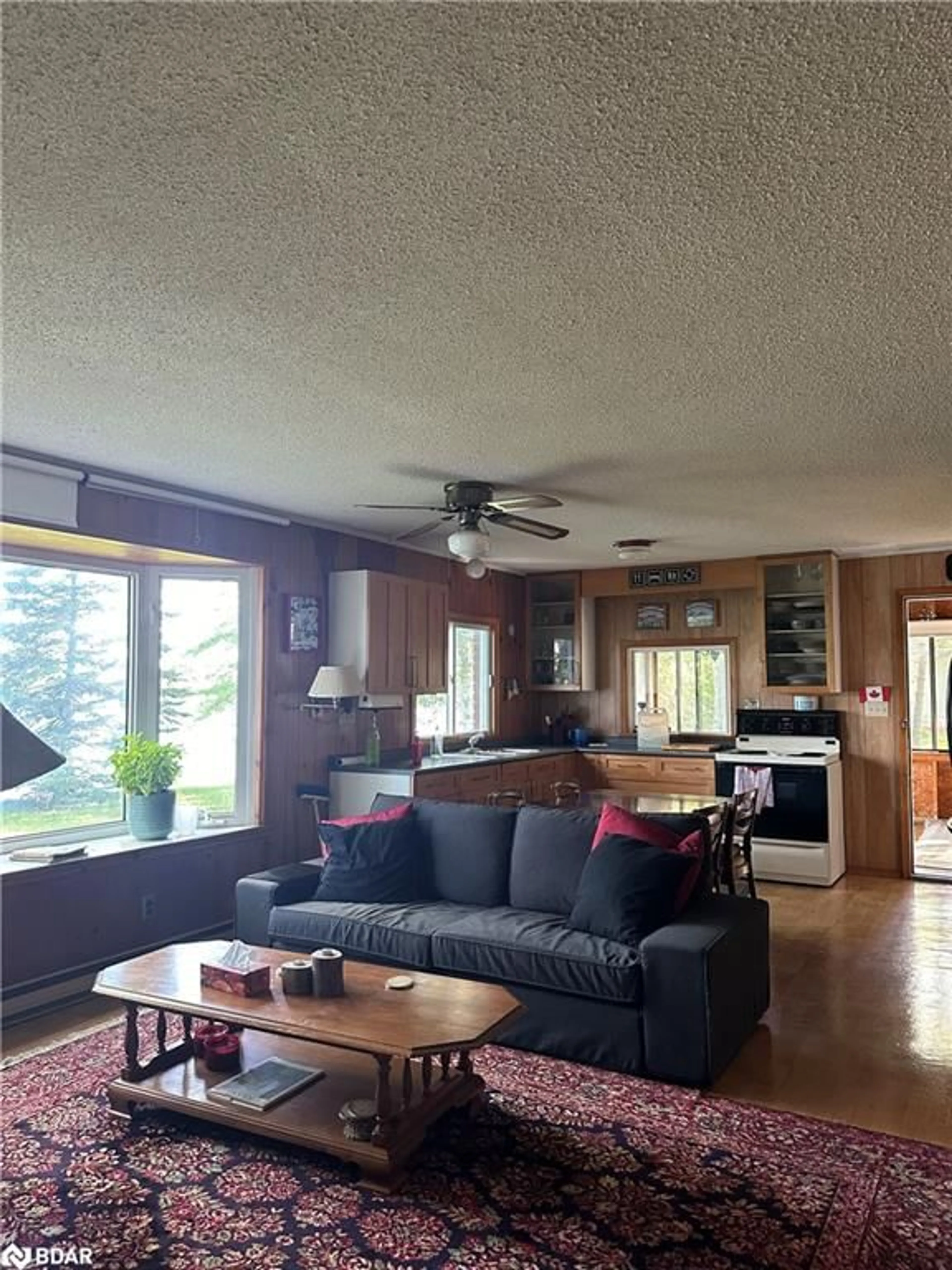 Living room with furniture, wood/laminate floor for 98 Mcleish Dr, Sebright Ontario L0K 1W0