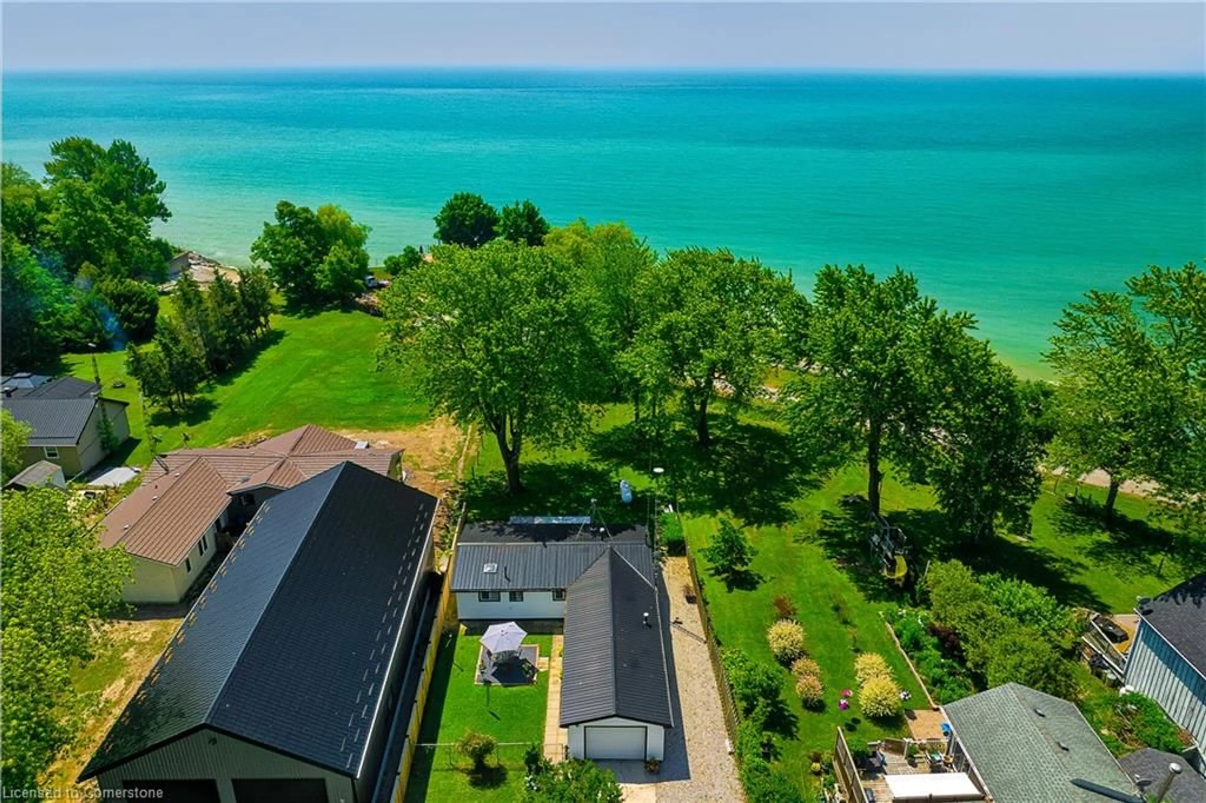 A pic from outside/outdoor area/front of a property/back of a property/a pic from drone, water/lake/river/ocean view for 3058 Lakeshore Rd, Dunnville Ontario N1A 2W8