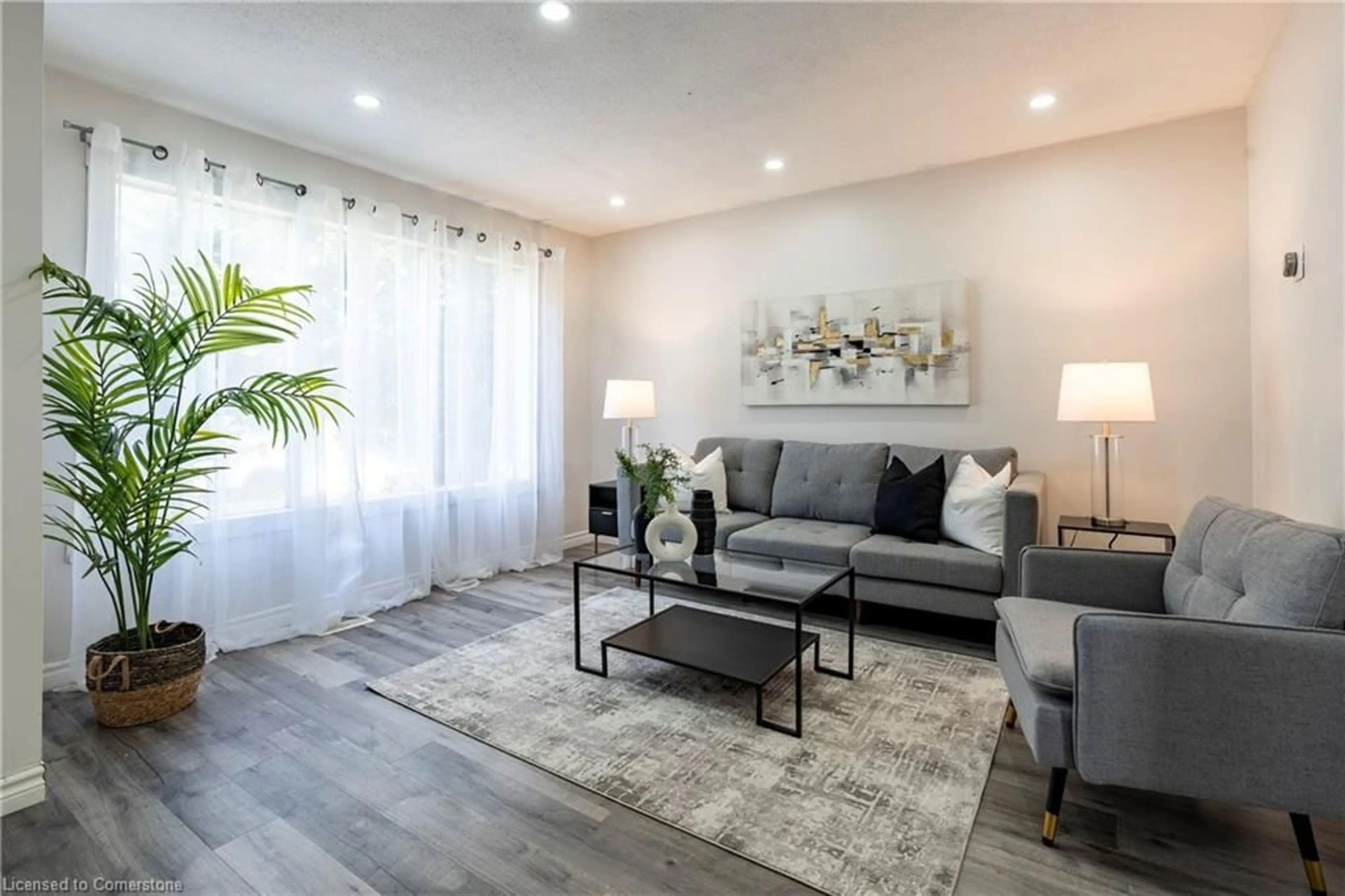 Living room with furniture, wood/laminate floor for 59 Winter Ave, Cambridge Ontario N1R 5Z7