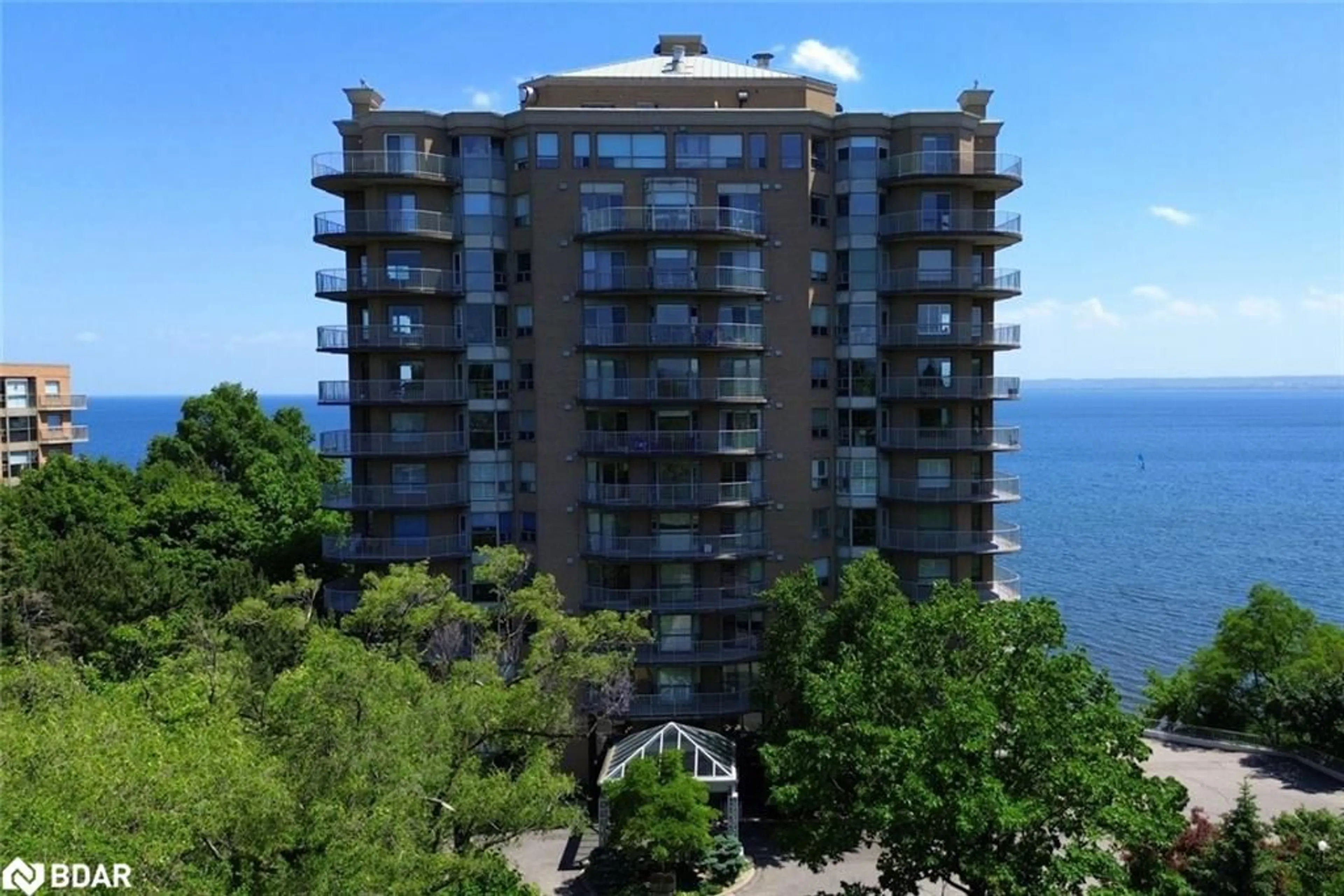 A pic from outside/outdoor area/front of a property/back of a property/a pic from drone, water/lake/river/ocean view for 2190 Lakeshore Rd #204, Burlington Ontario L7R 4K1