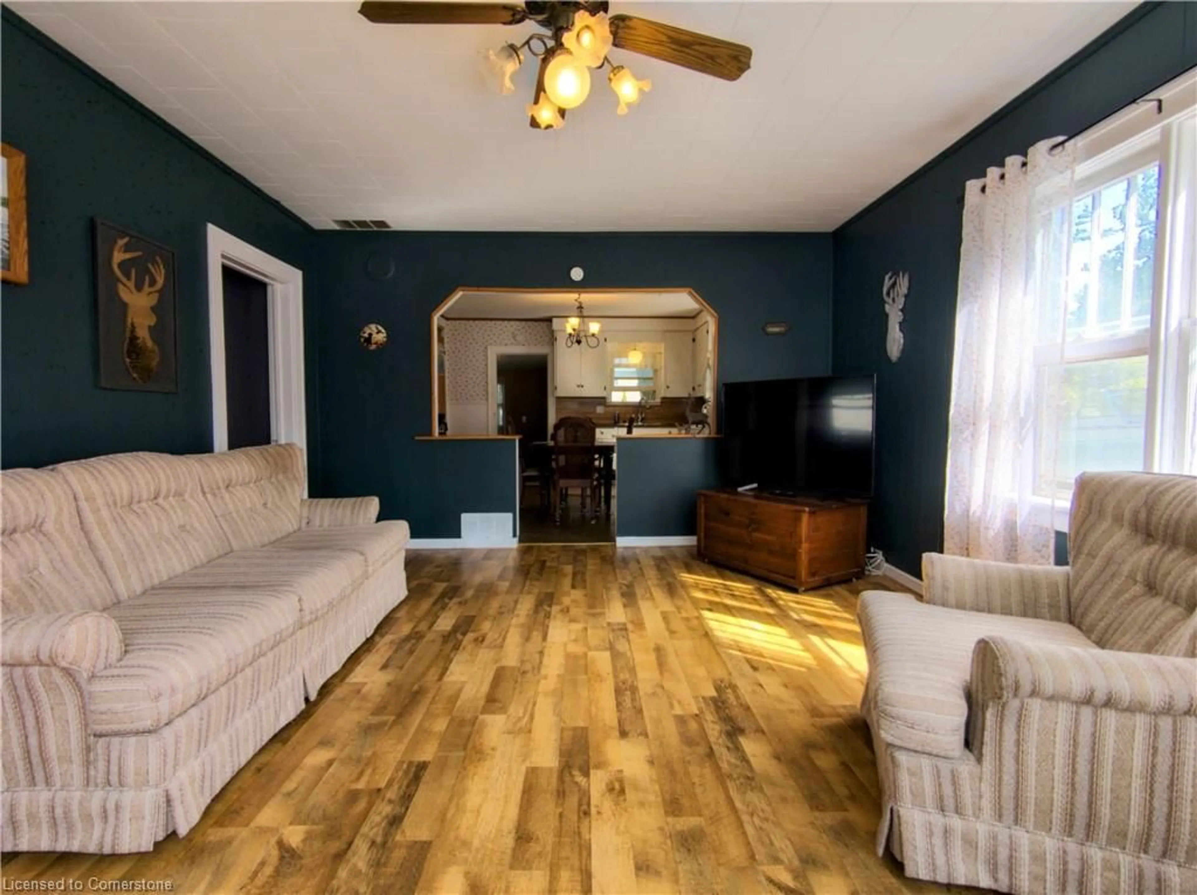 Living room with furniture, wood/laminate floor for 22 Price St, Port Rowan Ontario N0E 1M0