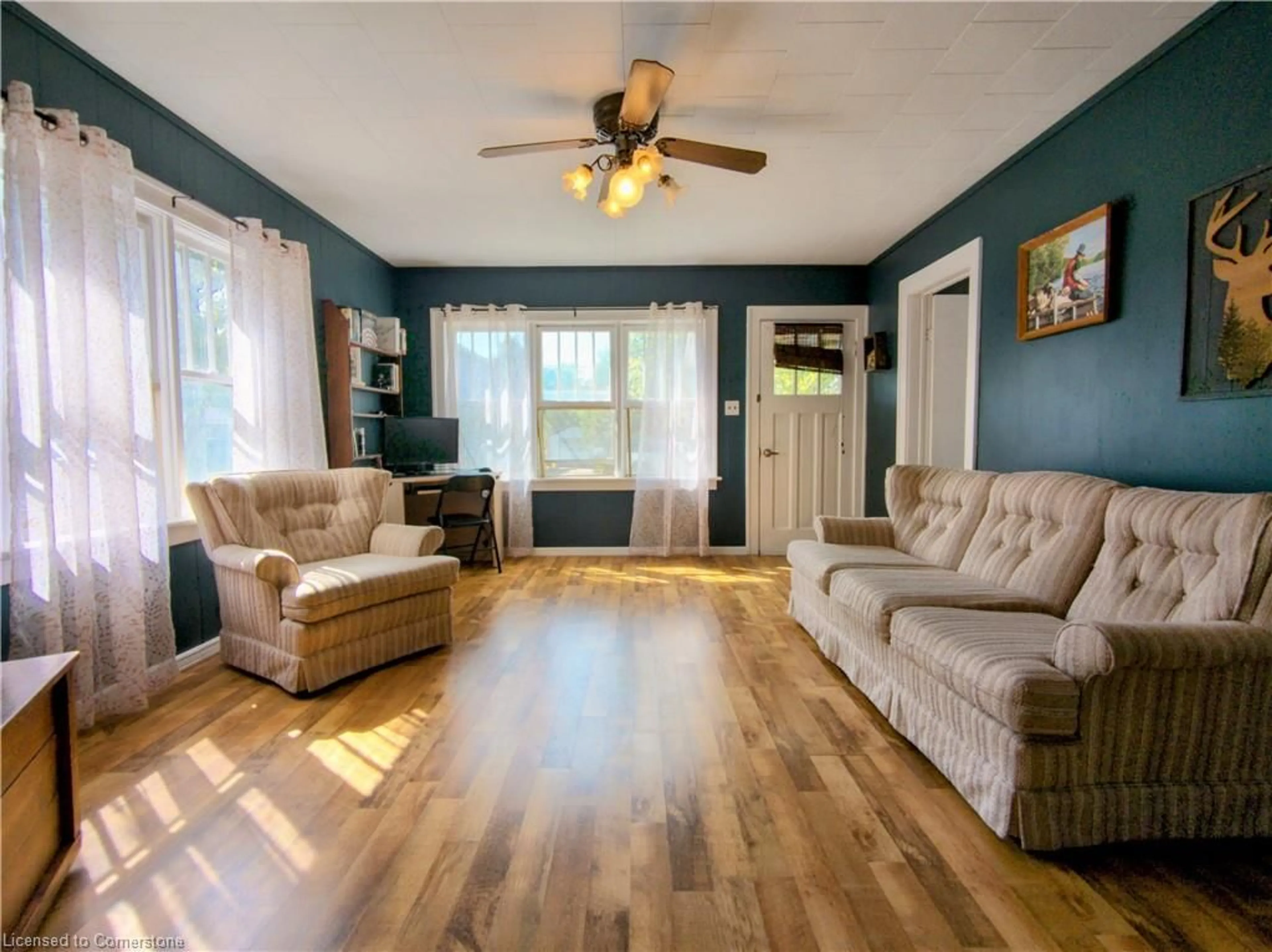 Living room with furniture, wood/laminate floor for 22 Price St, Port Rowan Ontario N0E 1M0
