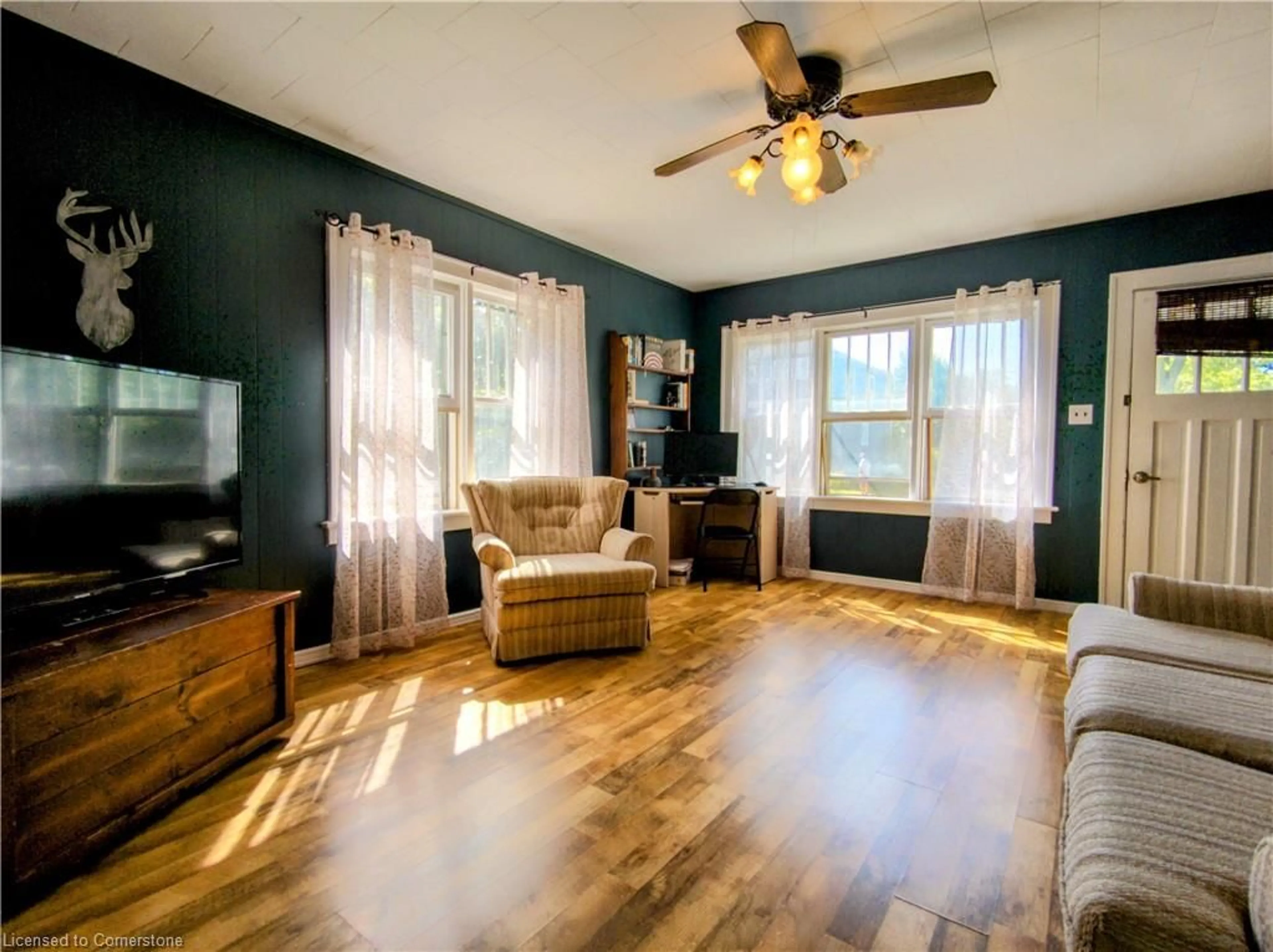 Living room with furniture, wood/laminate floor for 22 Price St, Port Rowan Ontario N0E 1M0