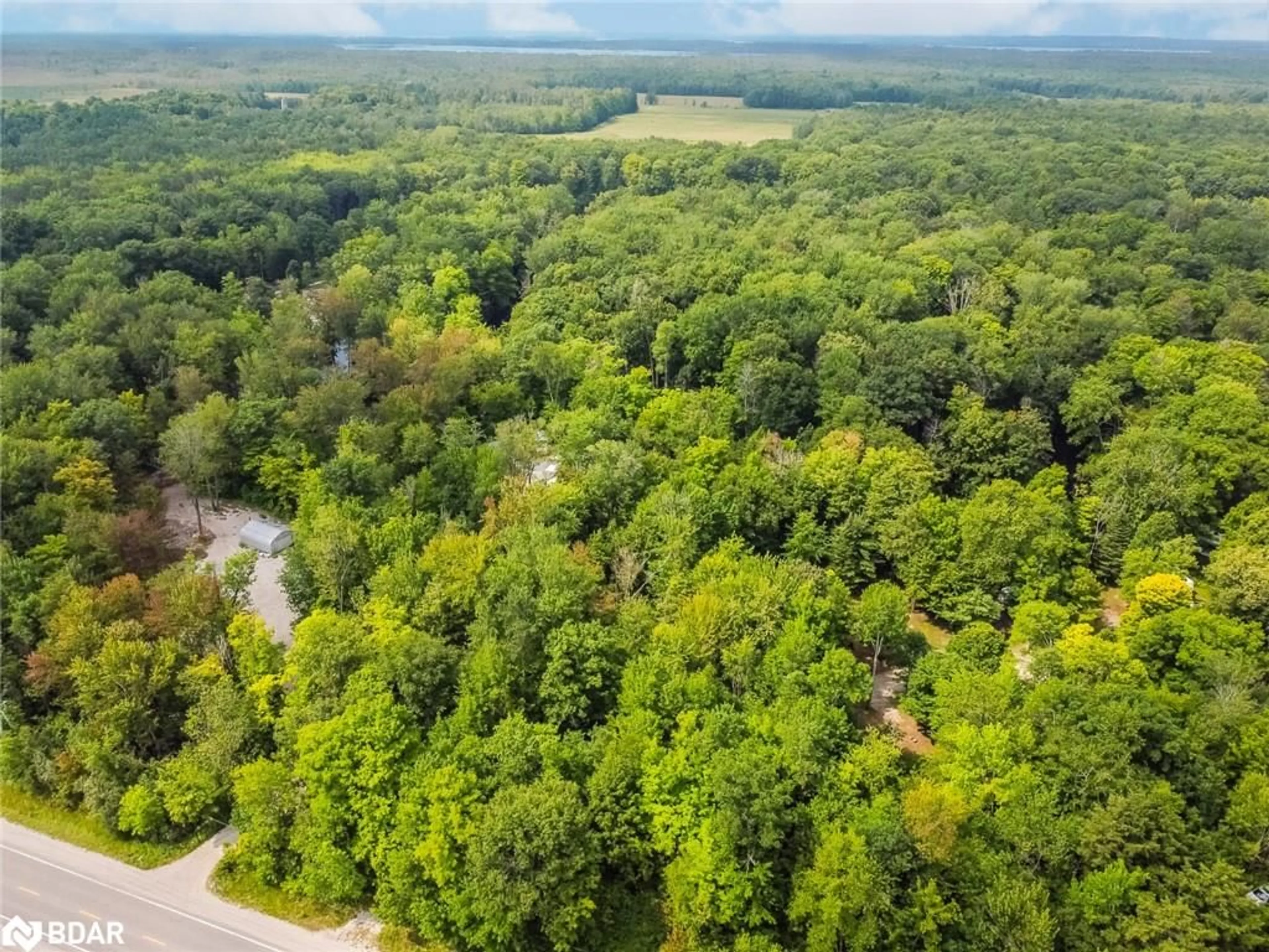 A pic from outside/outdoor area/front of a property/back of a property/a pic from drone, forest/trees view for 7012 County Road 169, Washago Ontario L0K 2B0