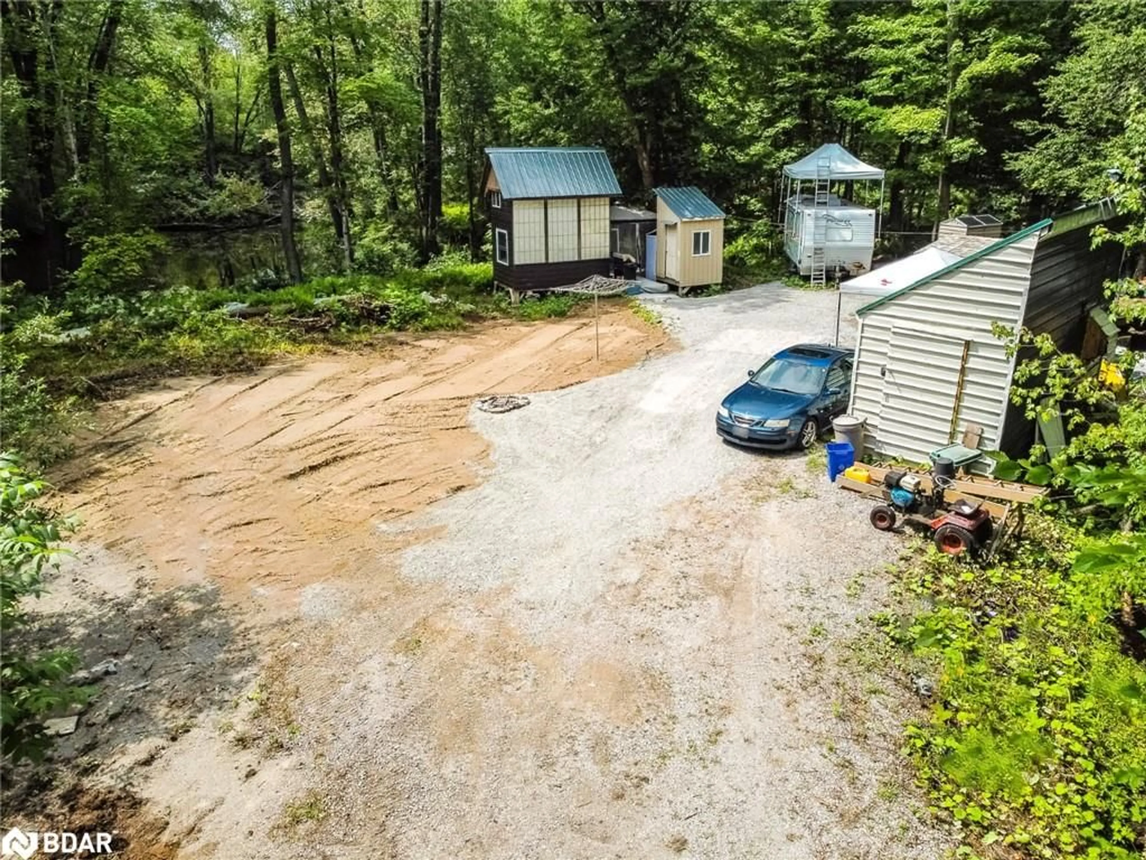 A pic from outside/outdoor area/front of a property/back of a property/a pic from drone, unknown for 7012 County Road 169, Washago Ontario L0K 2B0