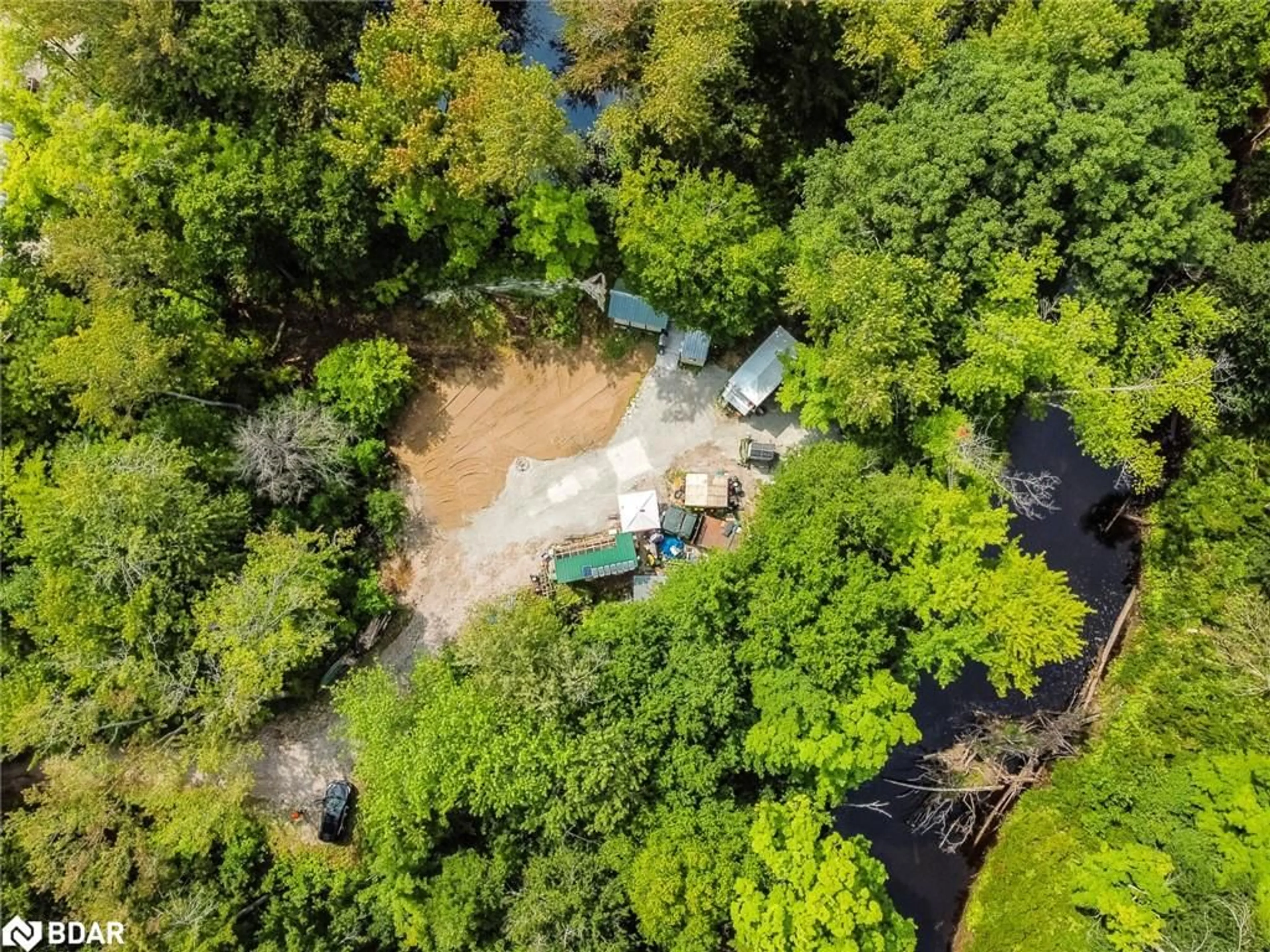 A pic from outside/outdoor area/front of a property/back of a property/a pic from drone, forest/trees view for 7012 County Road 169, Washago Ontario L0K 2B0