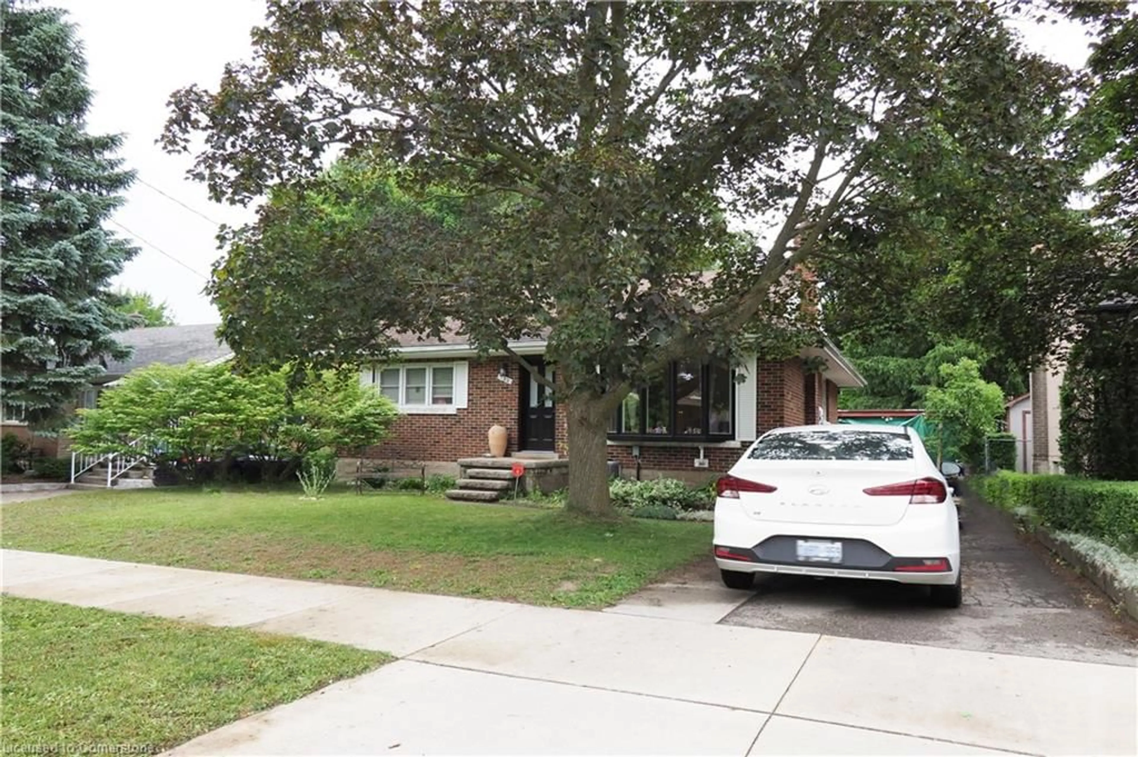 Home with brick exterior material, street for 122 Boehmer St, Kitchener Ontario N2H 4N5