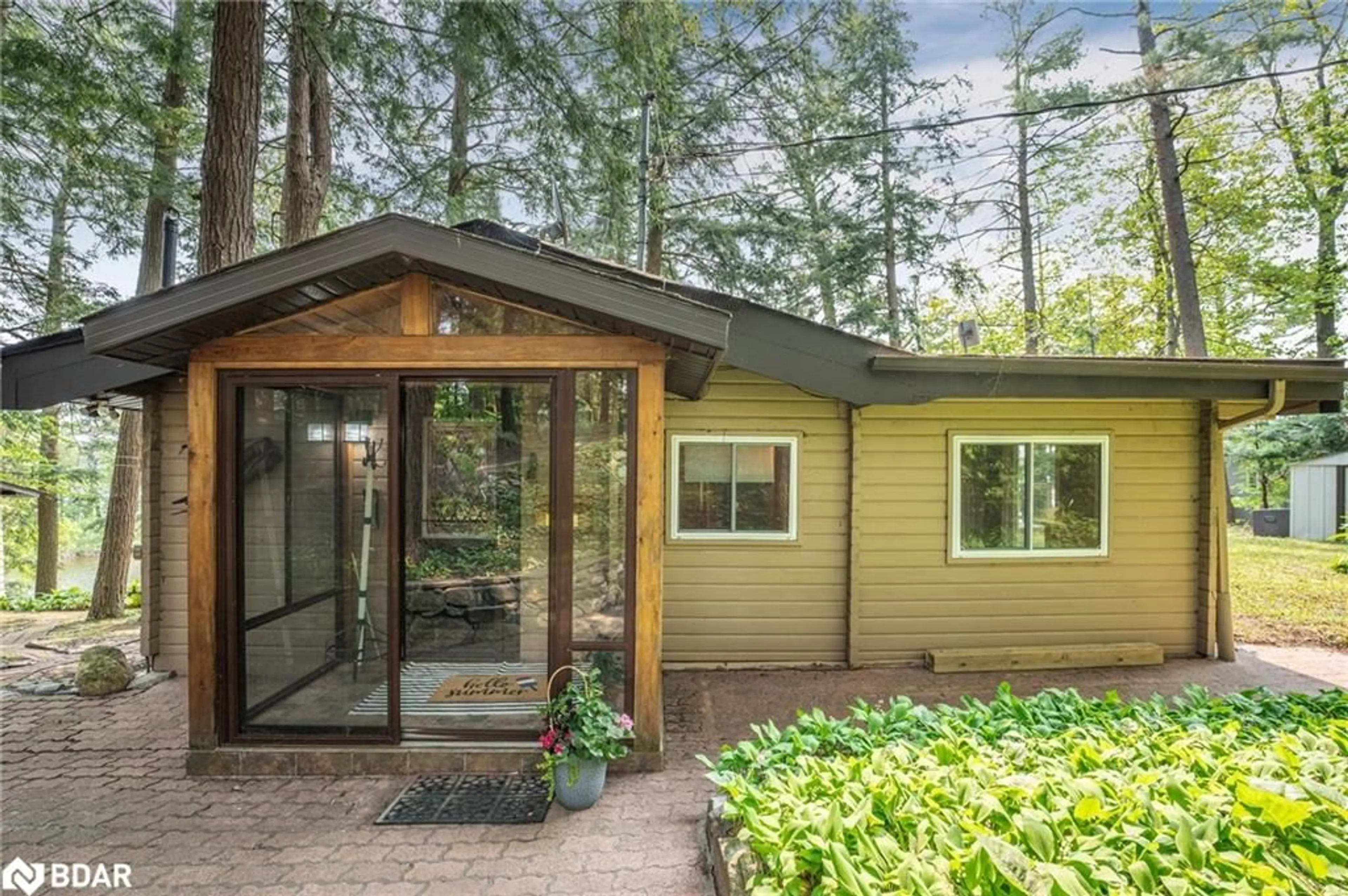 Home with vinyl exterior material, forest/trees view for 369 Stewart Lake Rd, Muskoka Lakes Ontario P0C 1H0