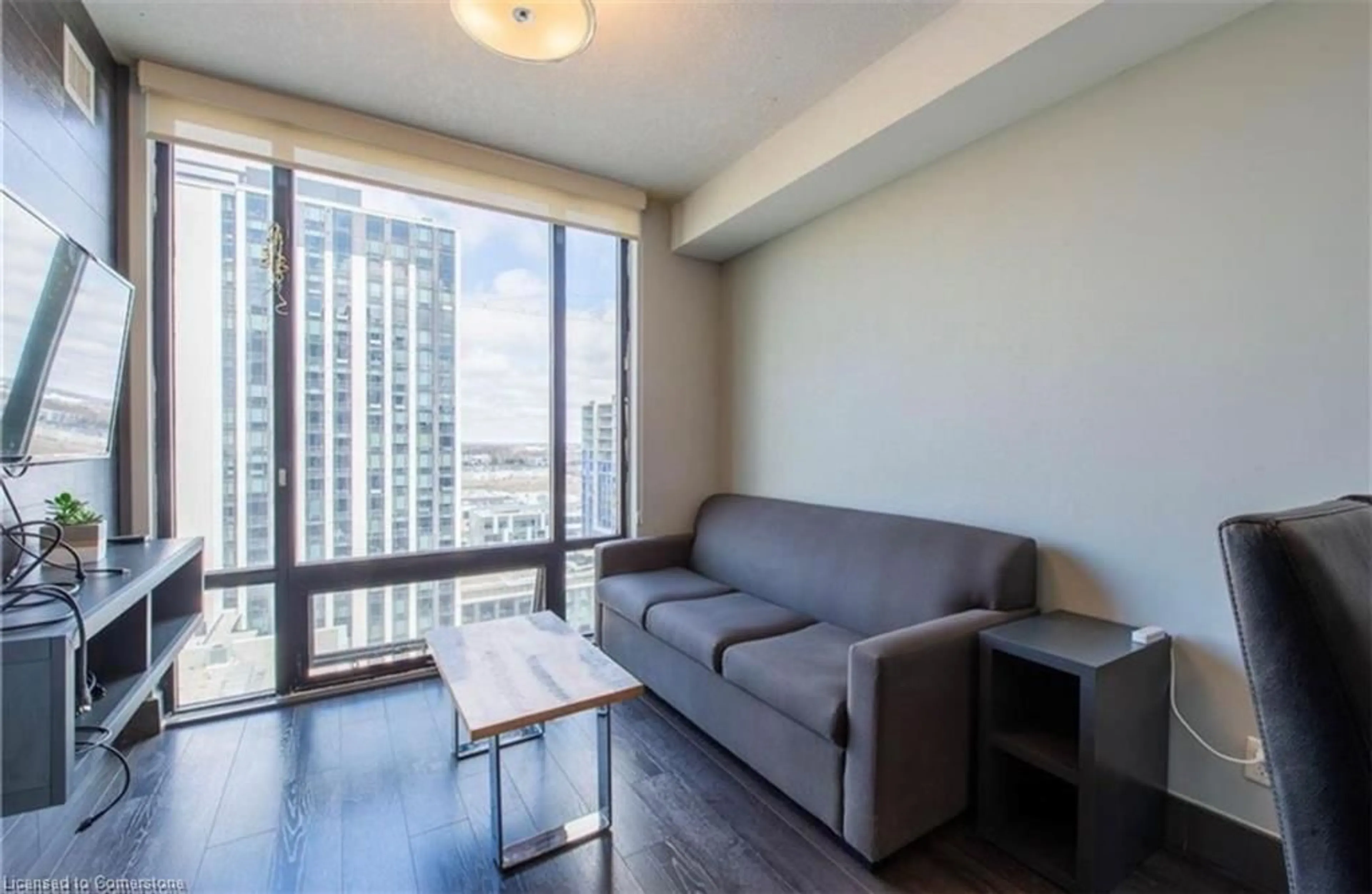 Living room with furniture, wood/laminate floor for 330 Phillip Street St #S2605, Waterloo Ontario N2L 3W9