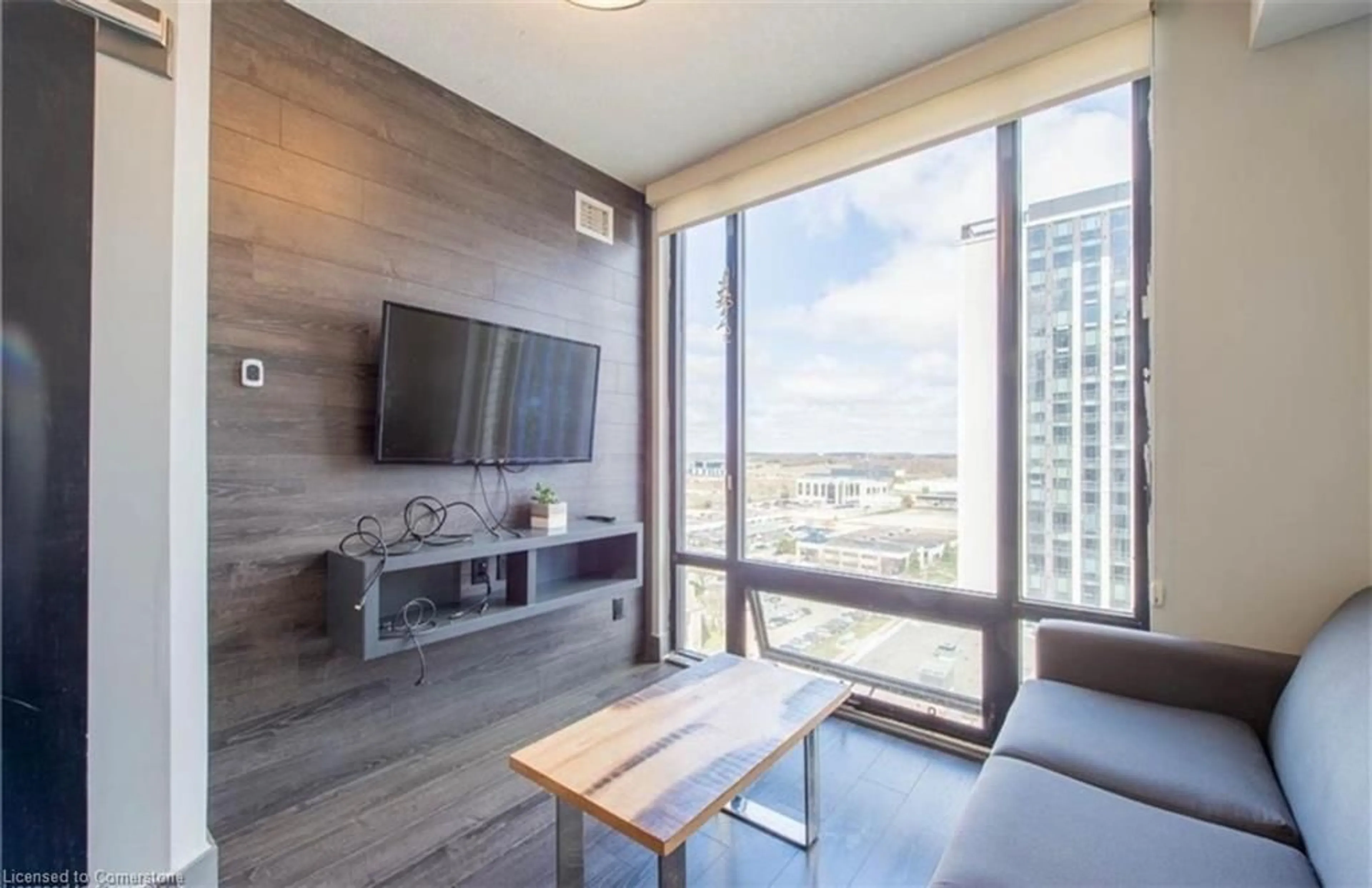 Living room with furniture, wood/laminate floor for 330 Phillip Street St #S2605, Waterloo Ontario N2L 3W9