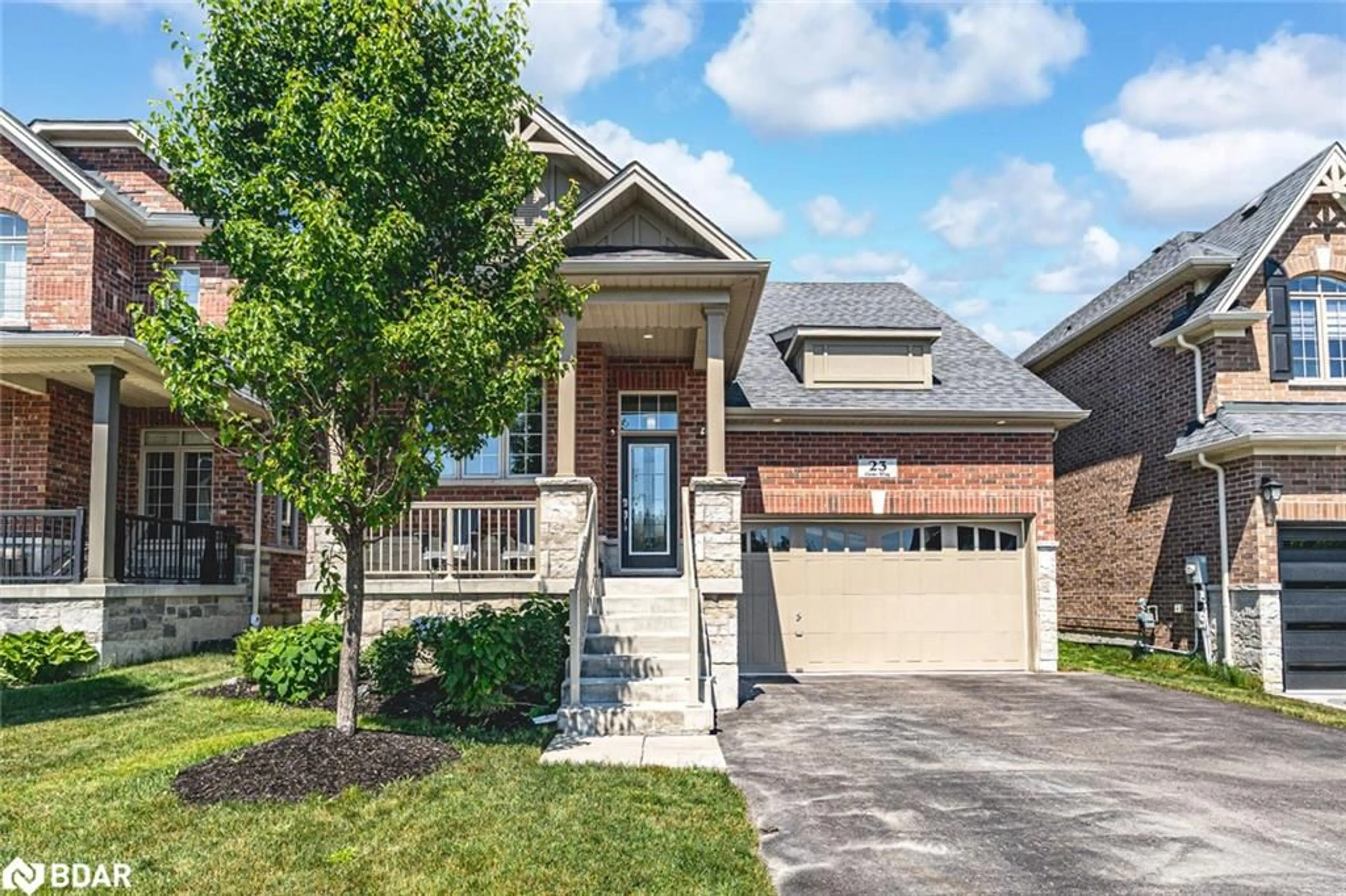 Home with brick exterior material, street for 23 Curtis Way, Springwater Ontario L9X 0S7