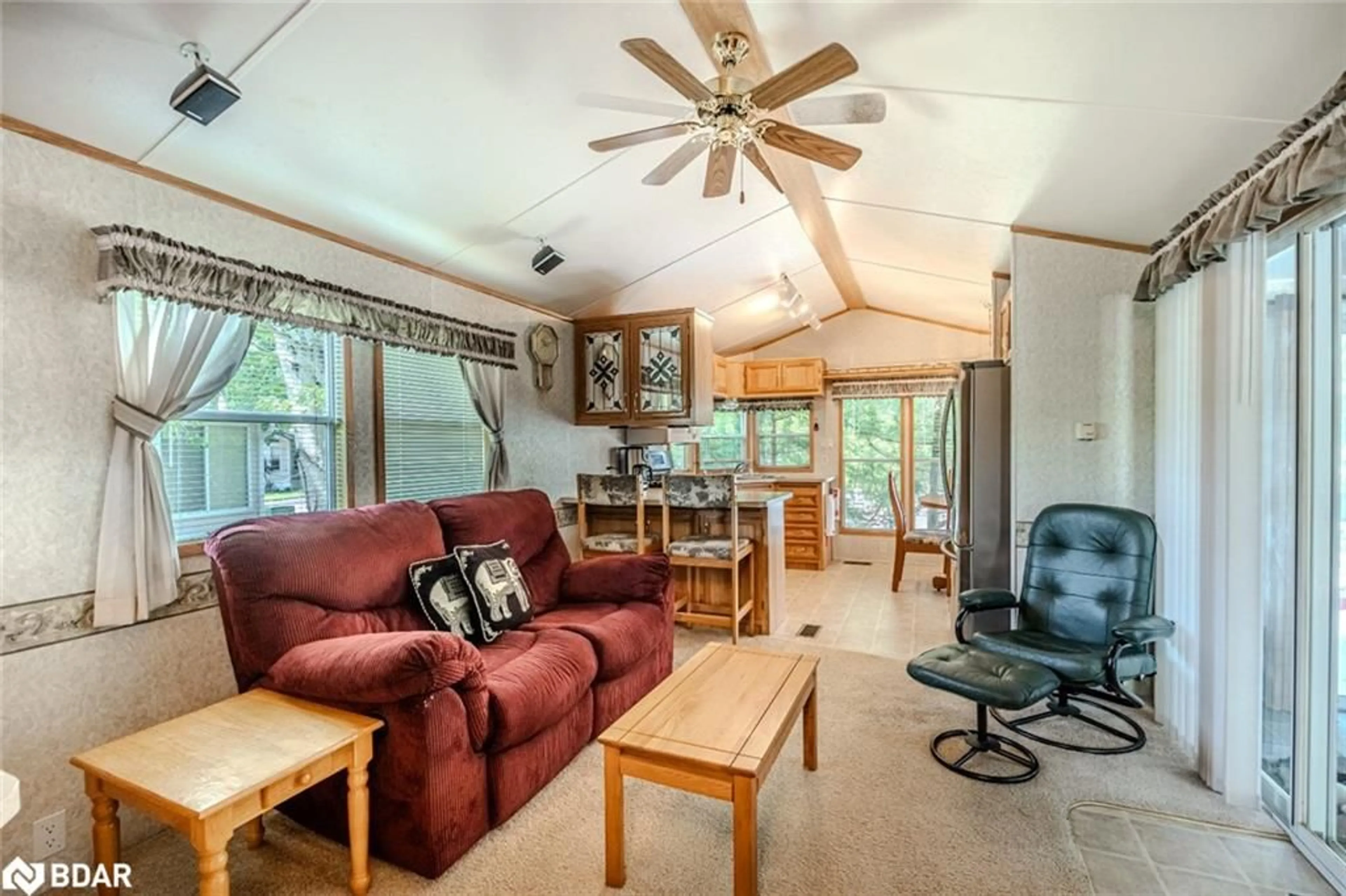 Living room with furniture, wood/laminate floor for 13 Huron Cir, Wasaga Beach Ontario L9Z 1X7