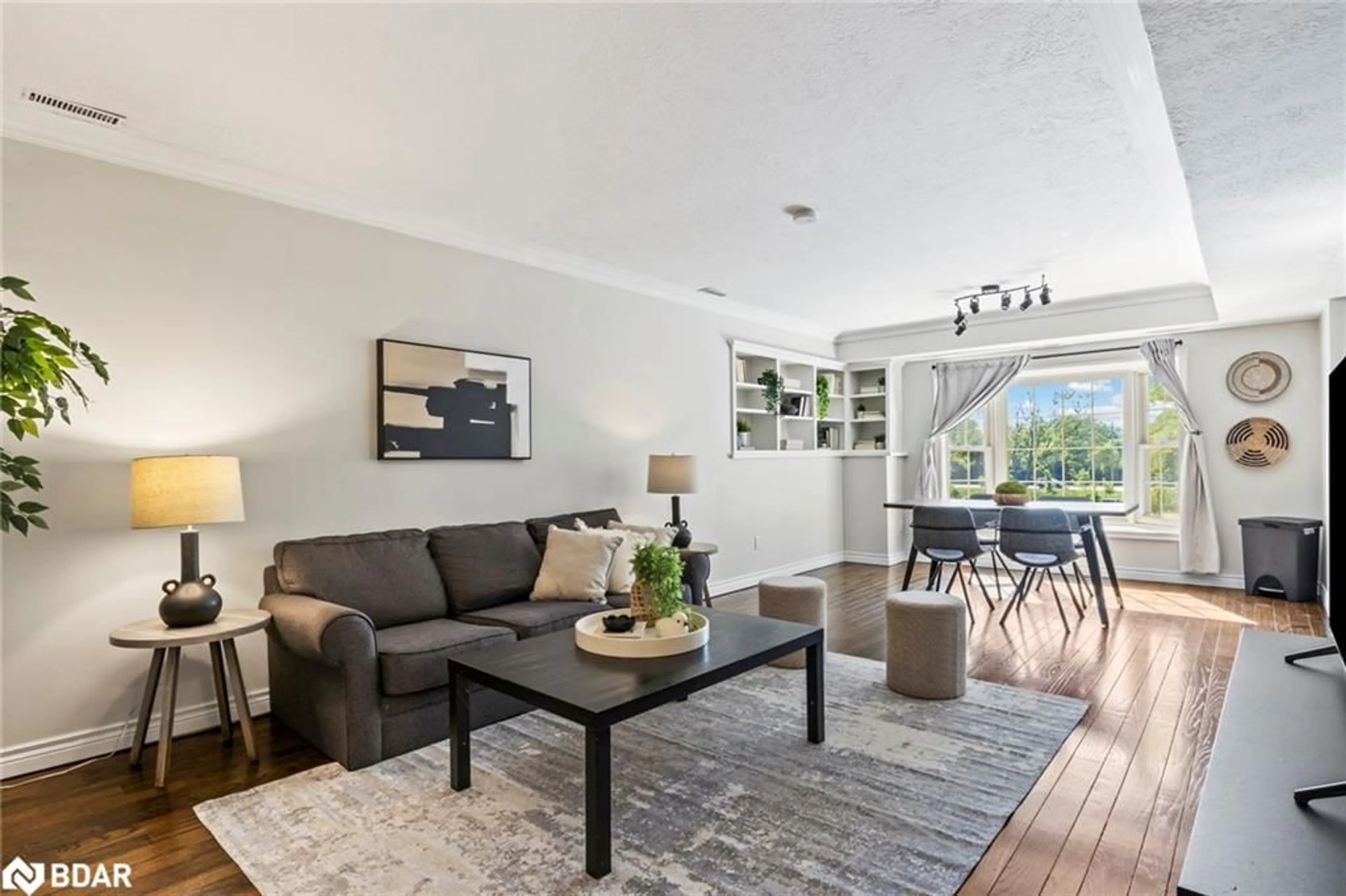 Living room with furniture, wood/laminate floor for 360 Waterloo Ave #209, Guelph Ontario N1H 8K7