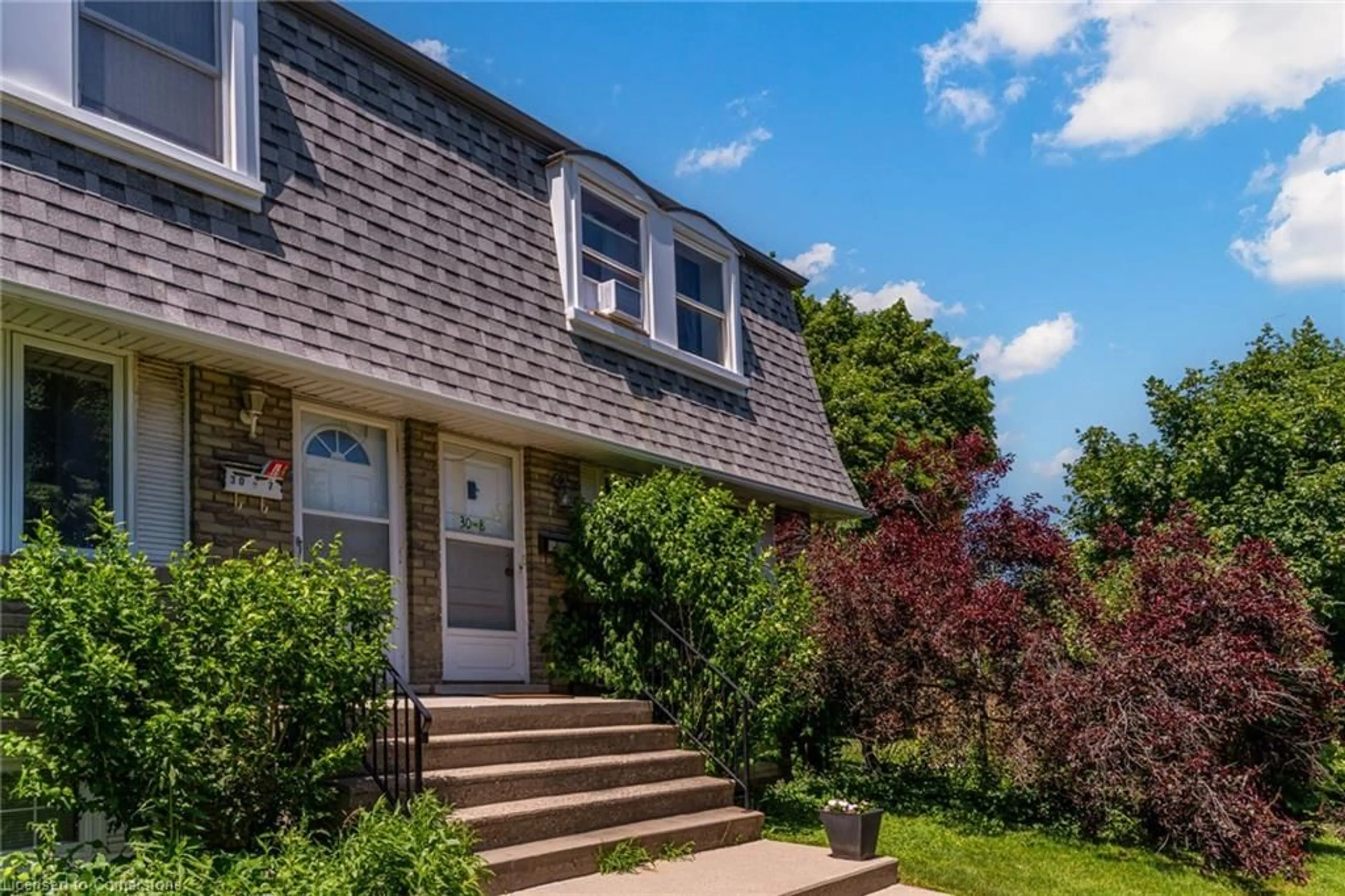 Home with vinyl exterior material, street for 30 Coachwood Rd #8, Brantford Ontario N3R 3R4