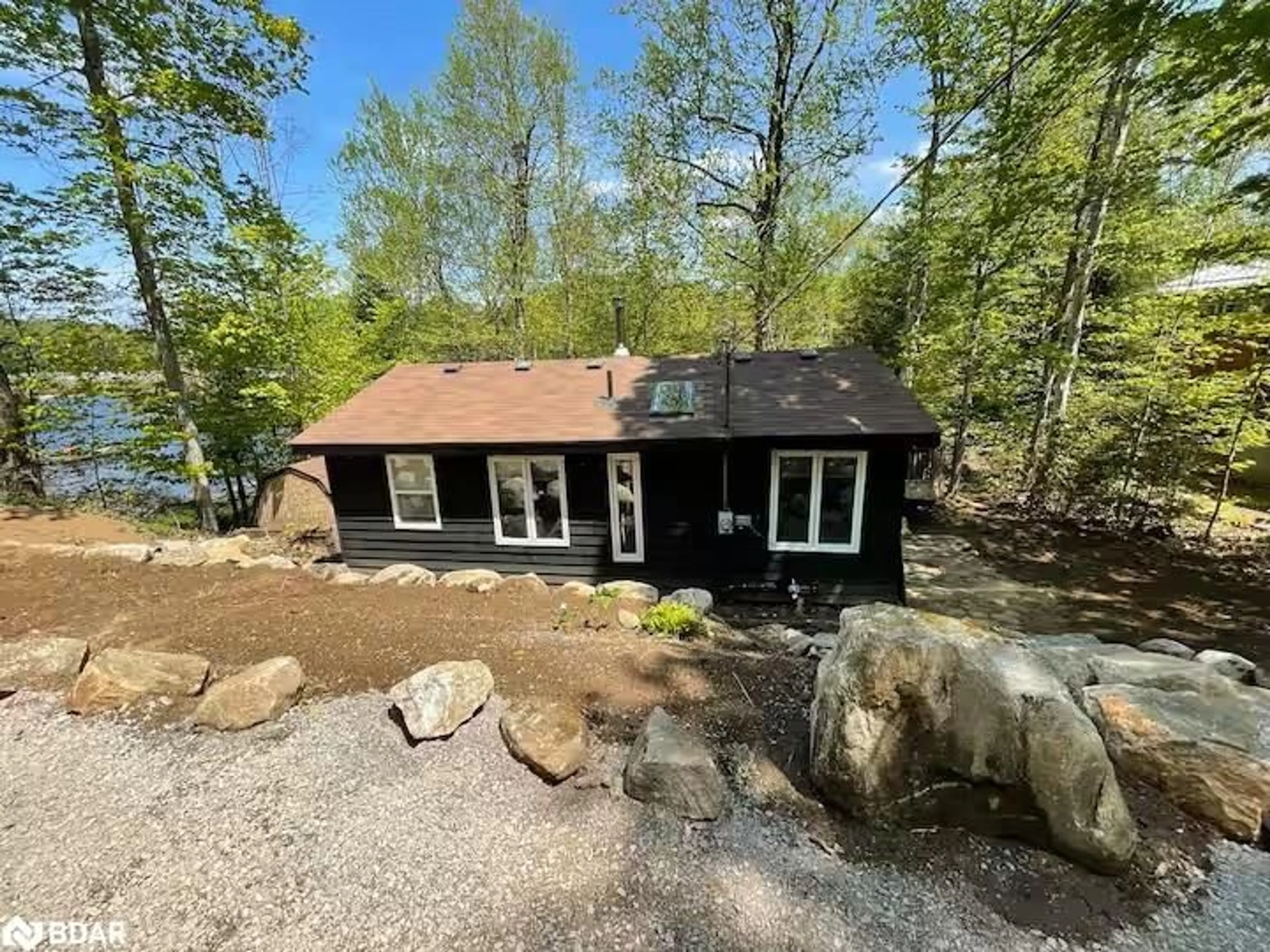 A pic from outside/outdoor area/front of a property/back of a property/a pic from drone, water/lake/river/ocean view for 1053 Esson Creek Lane, Wilberforce Ontario K0L 3C0
