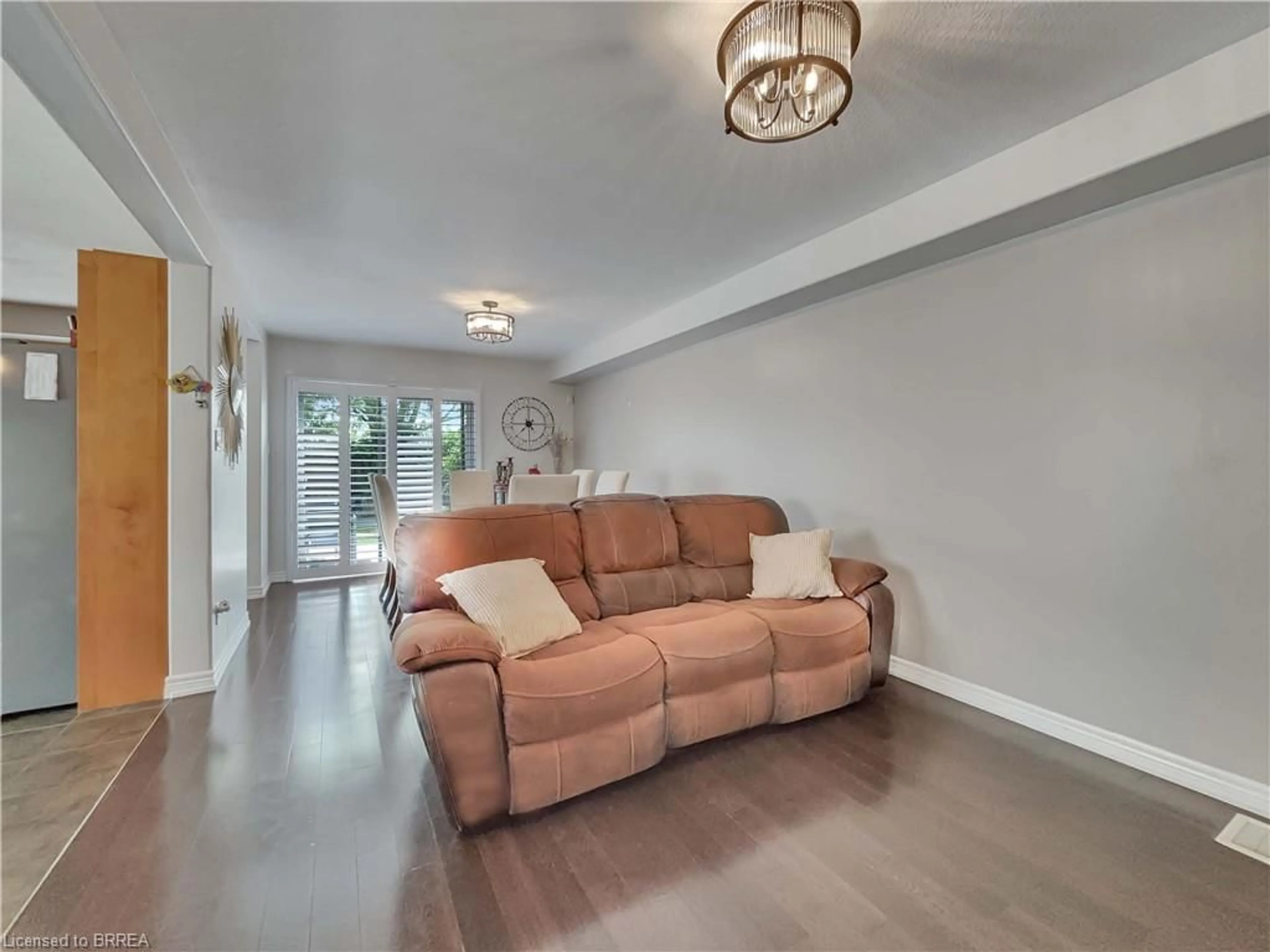 Living room with furniture, wood/laminate floor for 34 Magnificent Way, Hamilton Ontario L0R 1C0