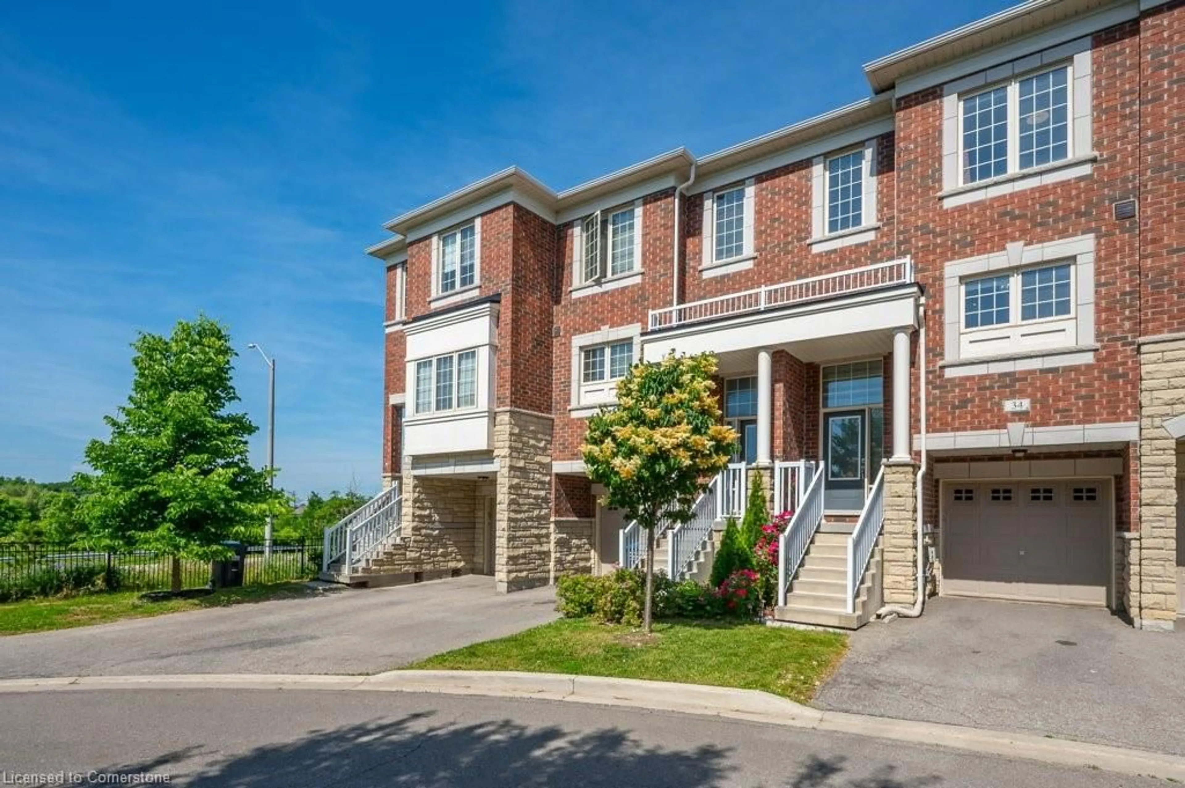 Home with brick exterior material, street for 34 Aspen Hills Road Rd #3, Brampton Ontario L6Y 6E4