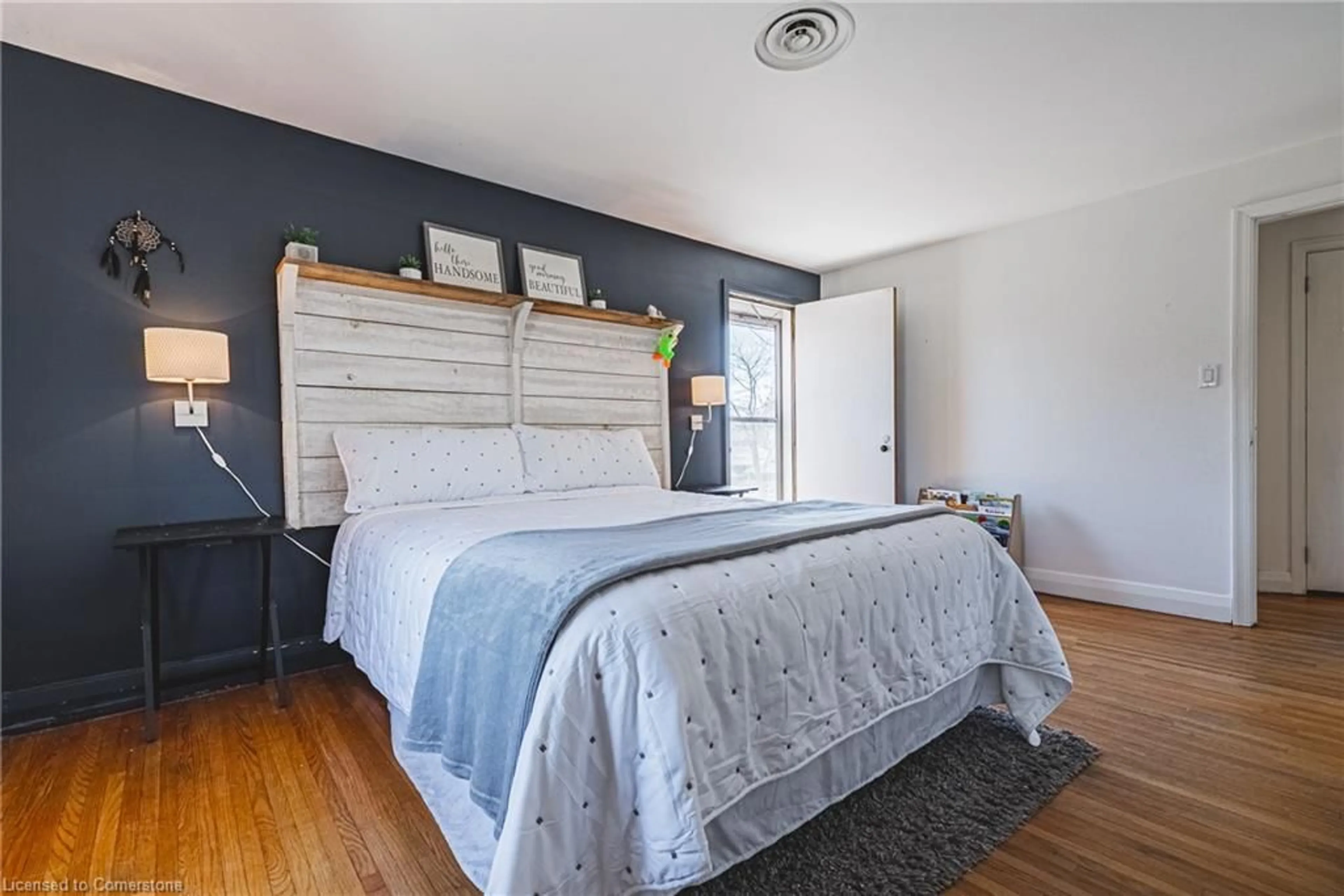 Bedroom with bed, wood/laminate floor for 43 Franklin St, Brantford Ontario N3R 1T2