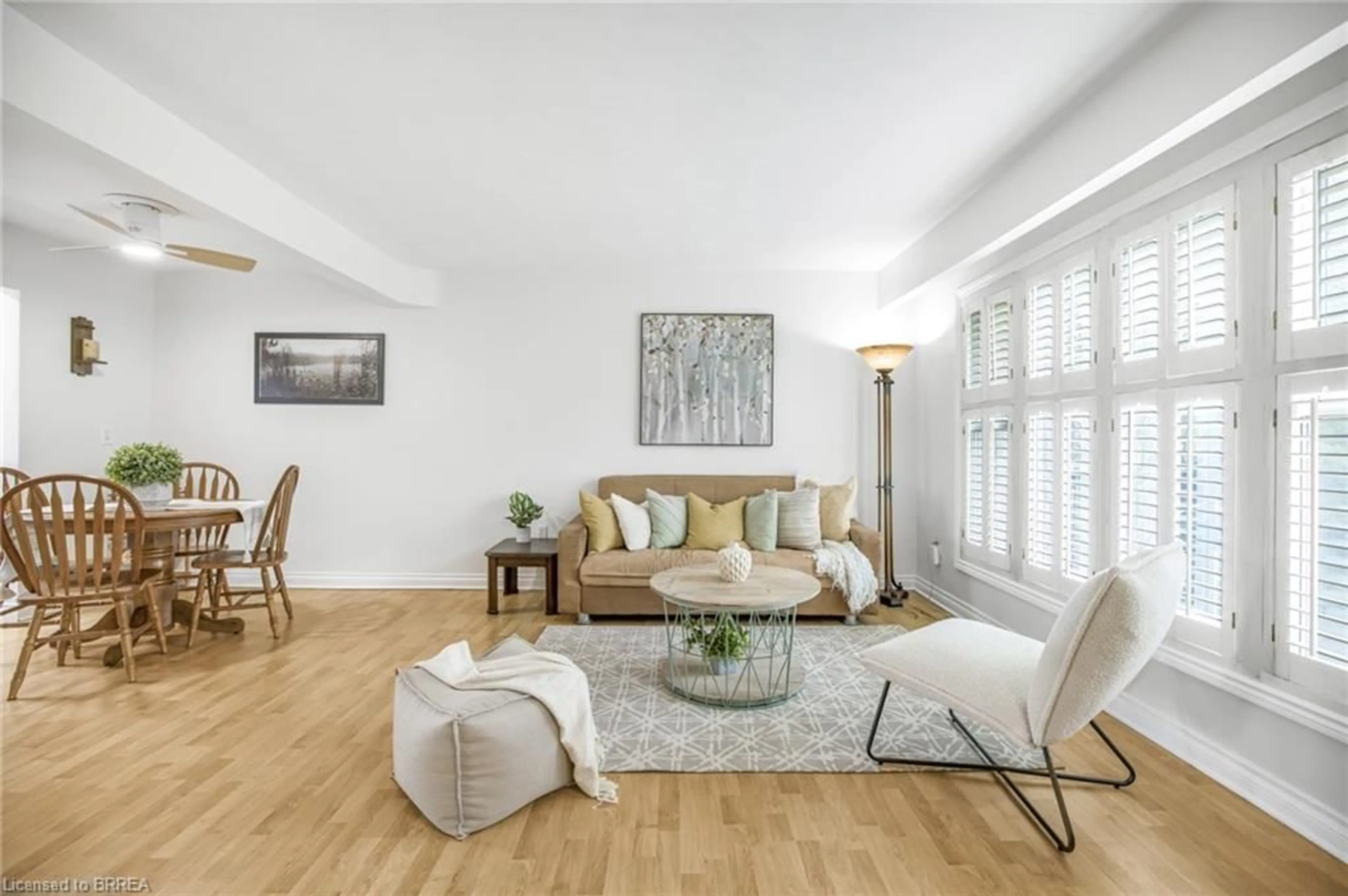 Living room with furniture, wood/laminate floor for 161 Berkindale Dr #5, Hamilton Ontario L8E 1M6