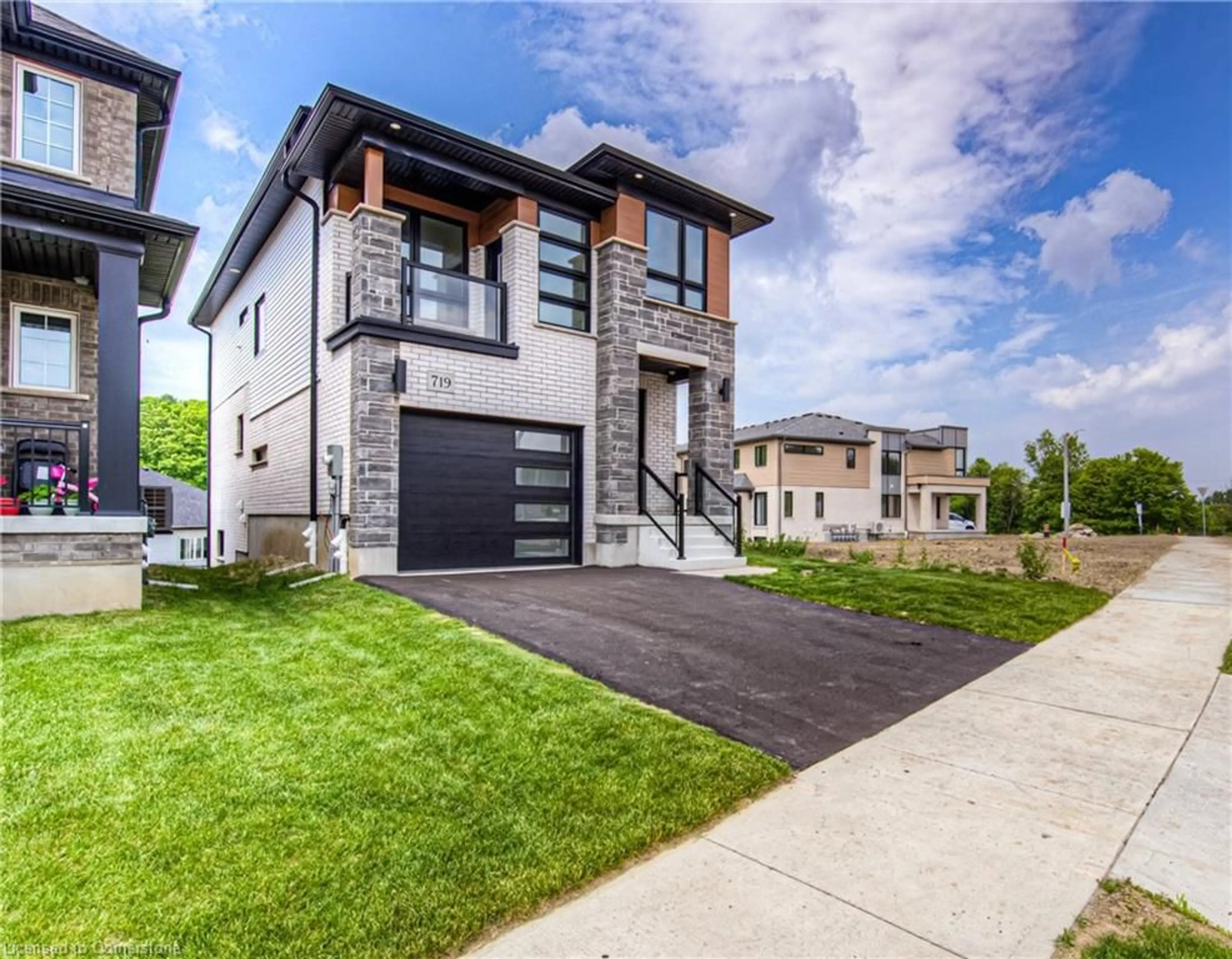 Home with brick exterior material, street for 719 Benninger Dr, Kitchener Ontario N2E 0J2