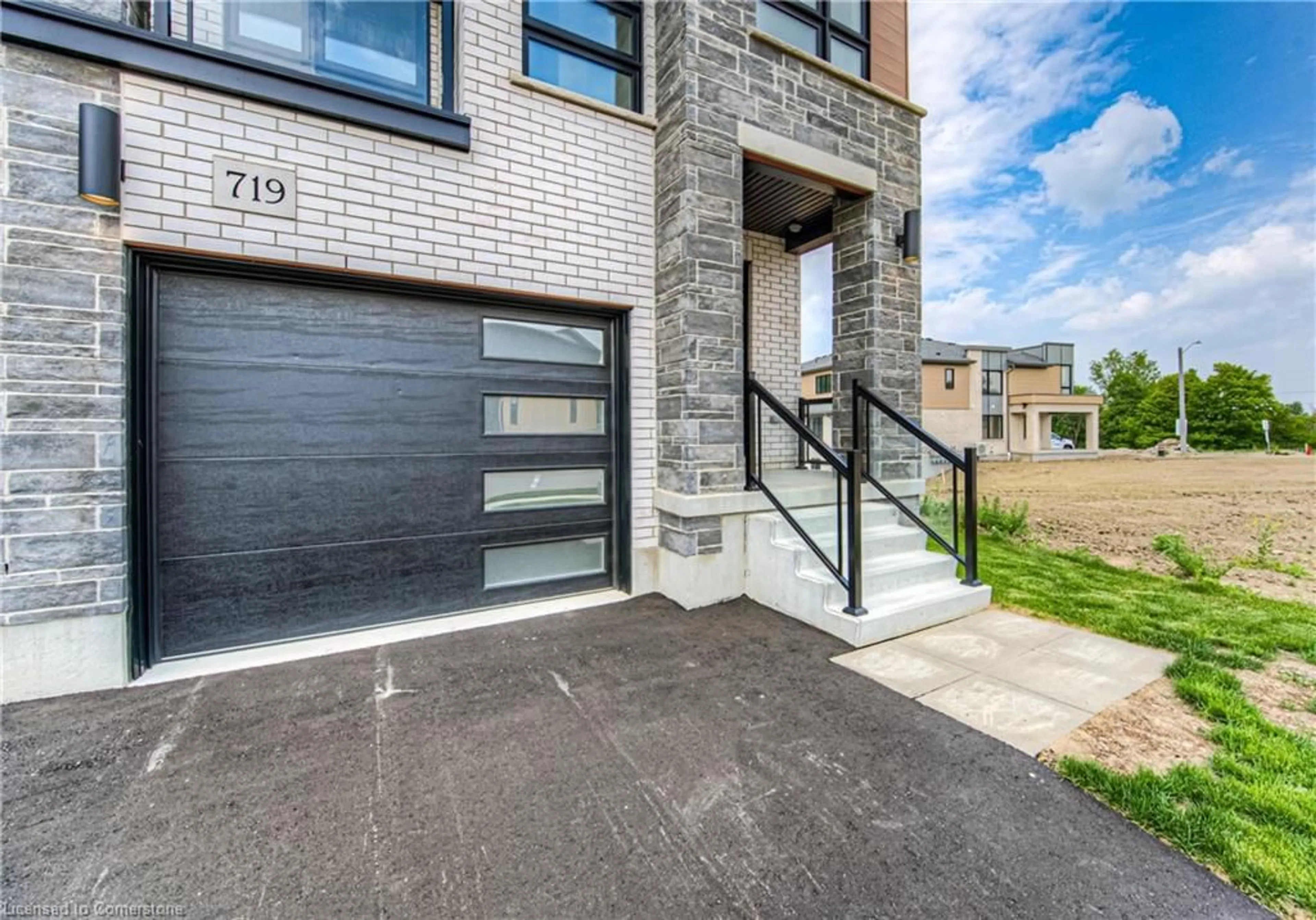 Home with brick exterior material, street for 719 Benninger Dr, Kitchener Ontario N2E 0J2
