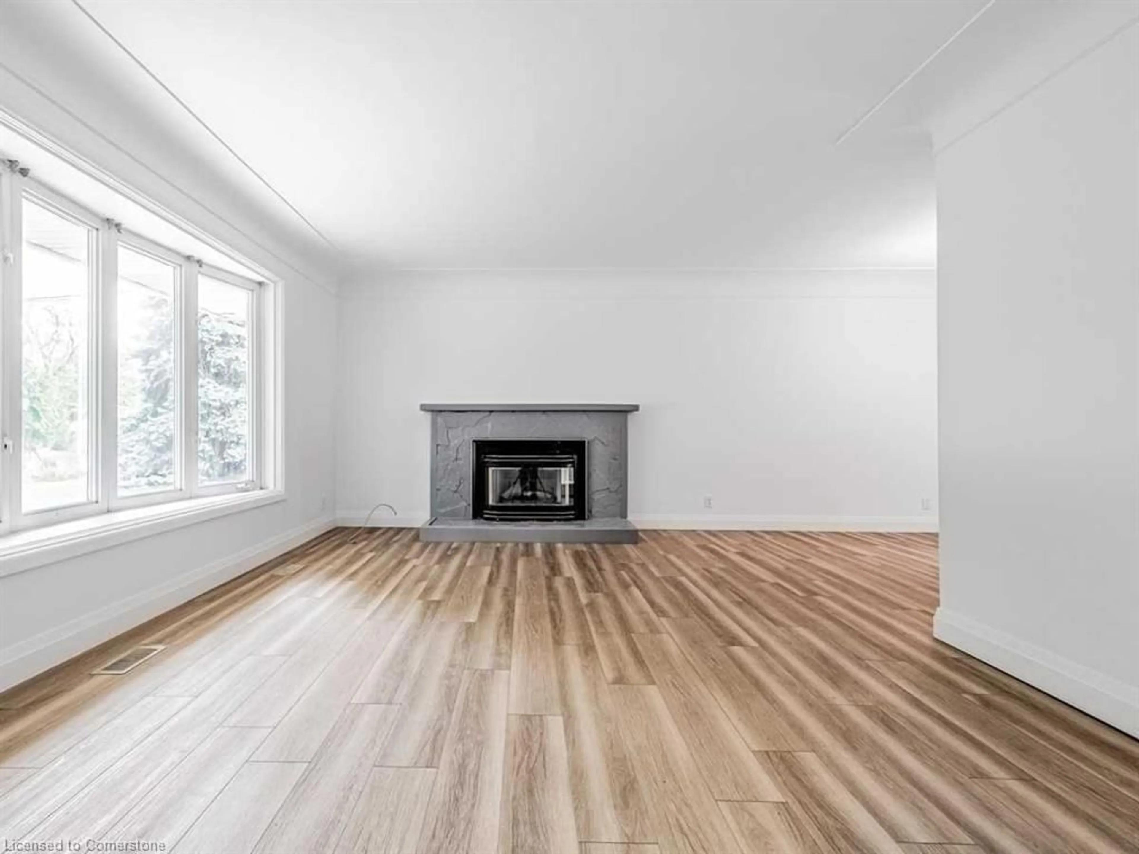 Living room with furniture, wood/laminate floor for 15 Miller Dr, Ancaster Ontario L9G 2H9