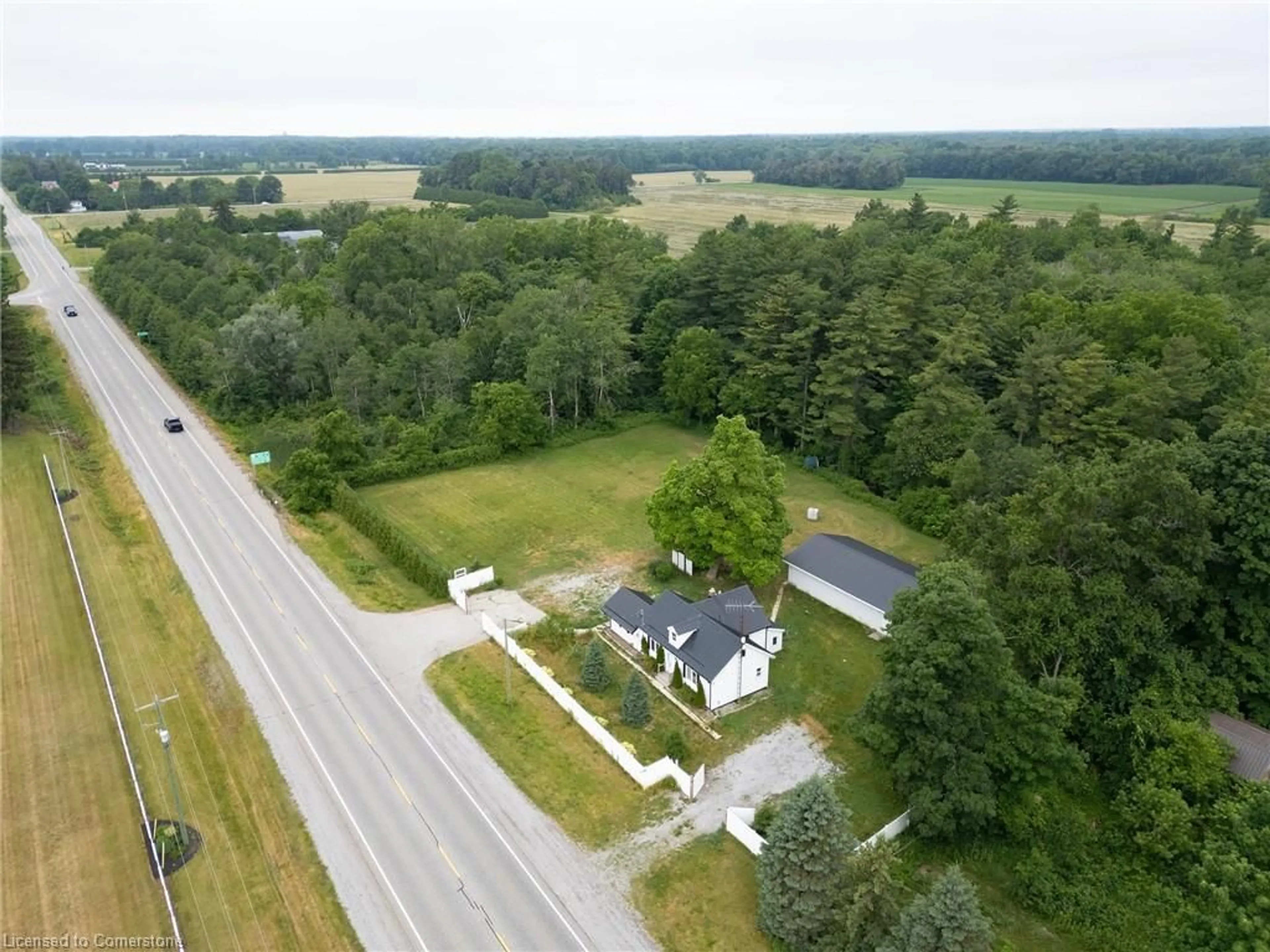 A pic from outside/outdoor area/front of a property/back of a property/a pic from drone, street for 3111 Highway 3, Simcoe Ontario N3Y 4J9