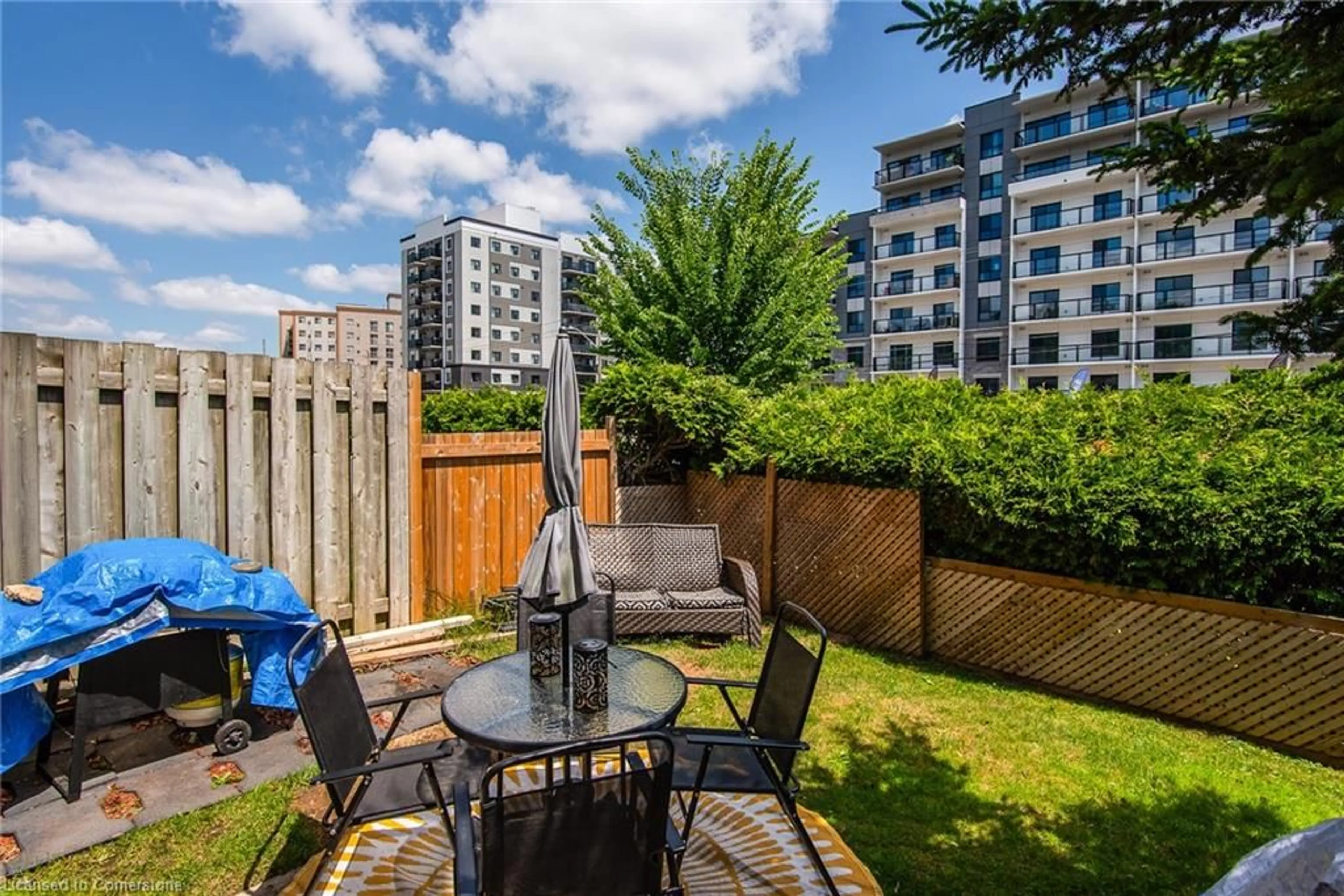 Patio, city buildings view from balcony for 634 Strasburg Rd #3, Kitchener Ontario N2E 2G8