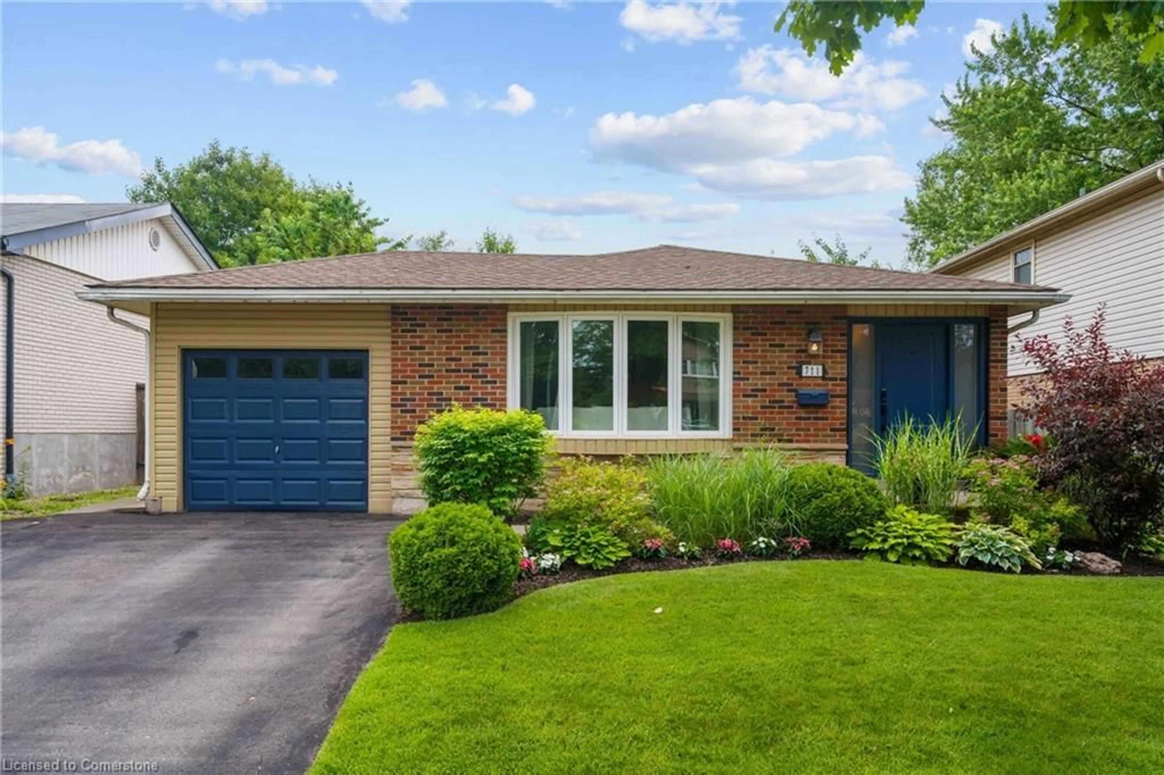 Home with brick exterior material, street for 711 Mullin Way, Burlington Ontario L7L 4J6