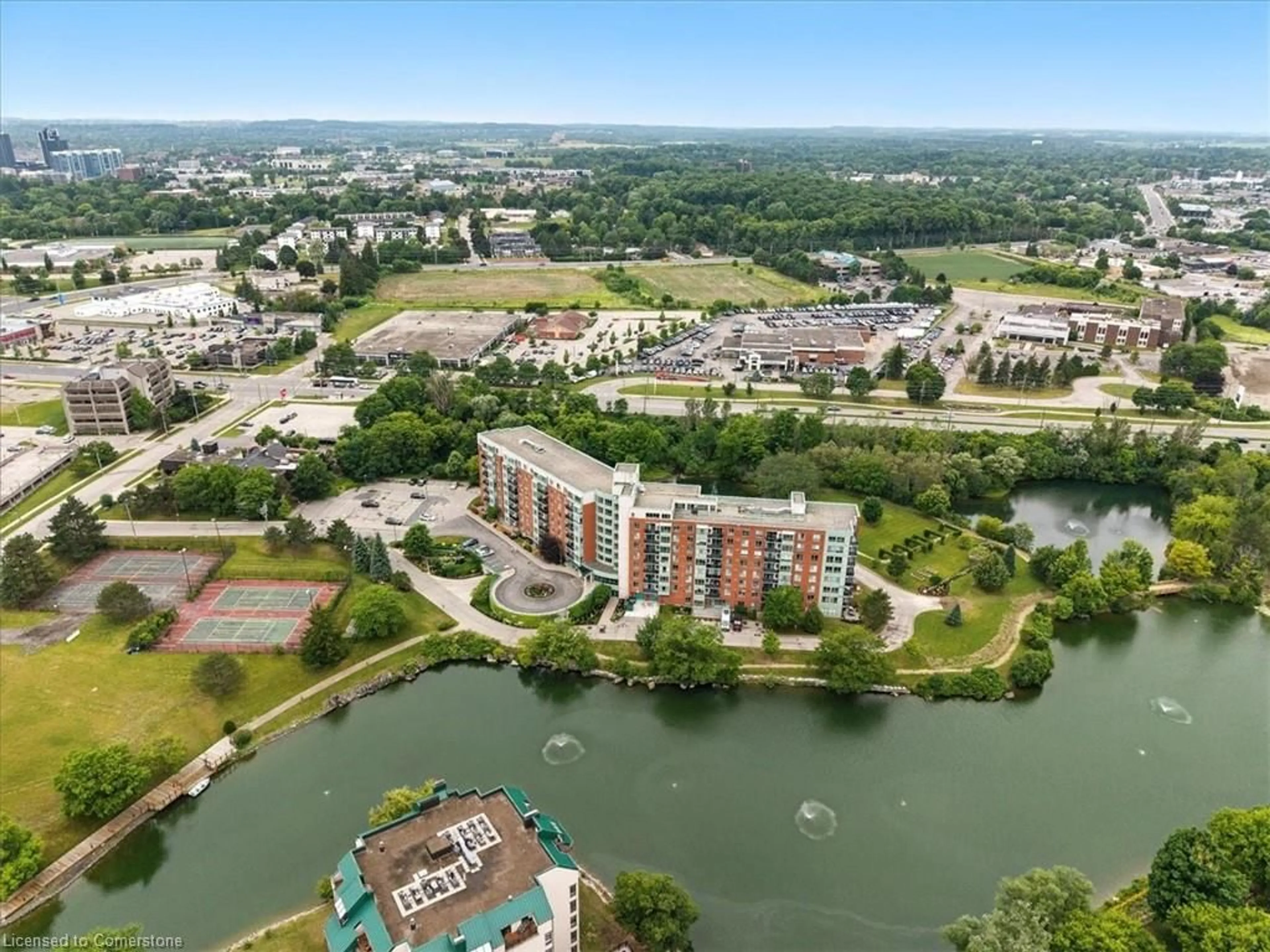 A pic from outside/outdoor area/front of a property/back of a property/a pic from drone, water/lake/river/ocean view for 30 Blue Springs Dr #201, Waterloo Ontario N2J 4T2