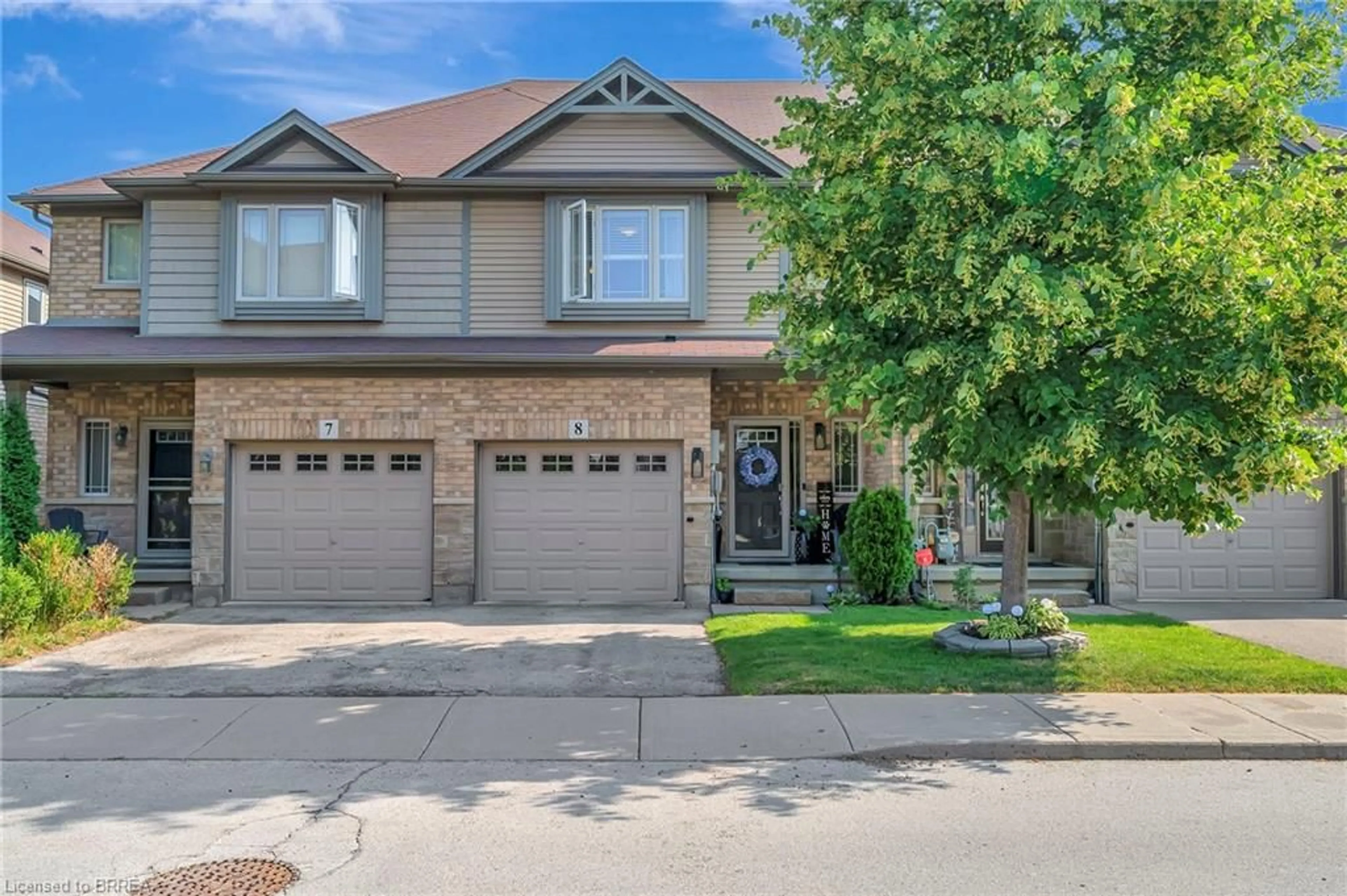 Home with brick exterior material, street for 310 Fall Fair Way #8, Hamilton Ontario L0R 1C0
