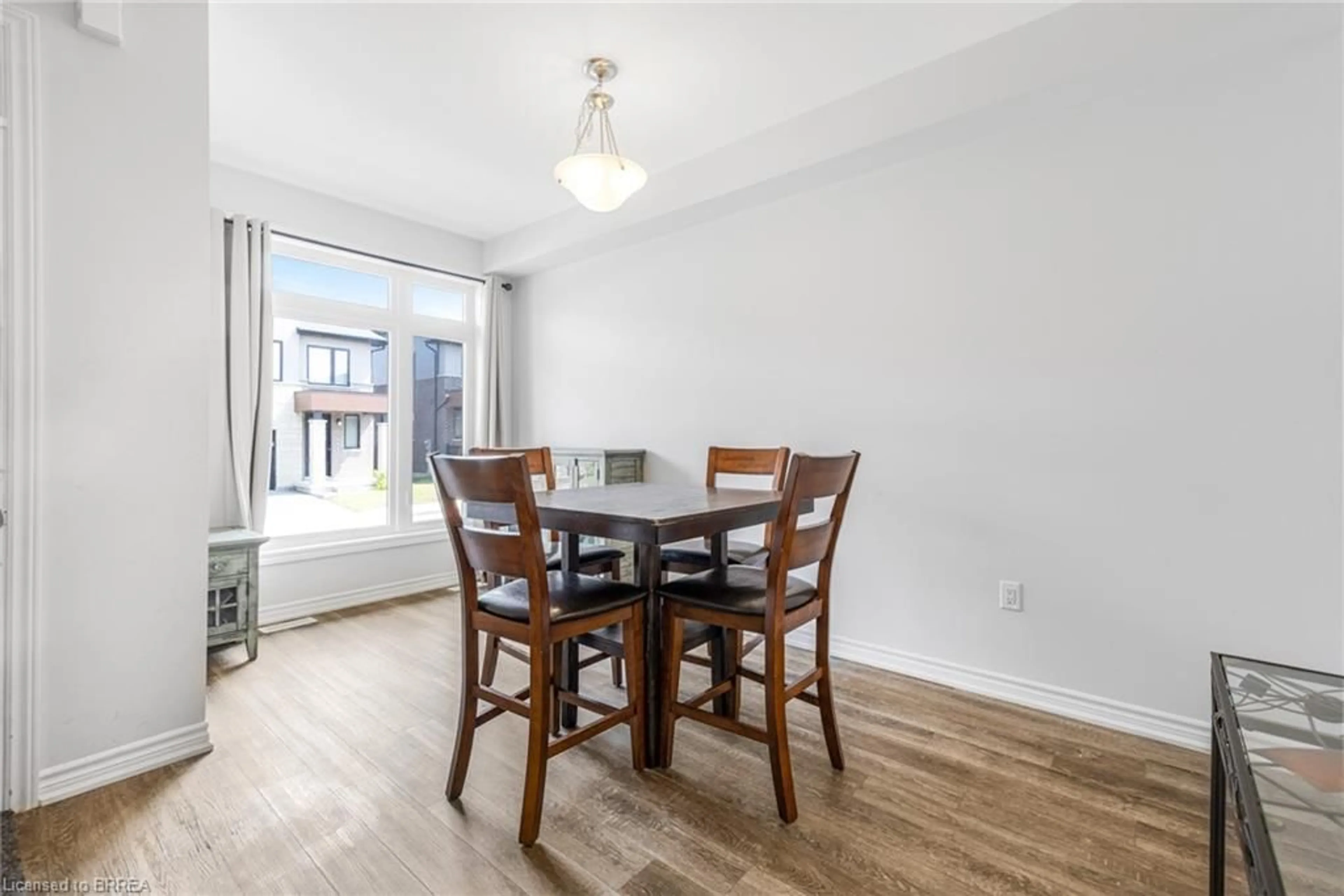 Dining room, wood/laminate floor for 30 Bensley Lane, Hamilton Ontario L9C 0E7