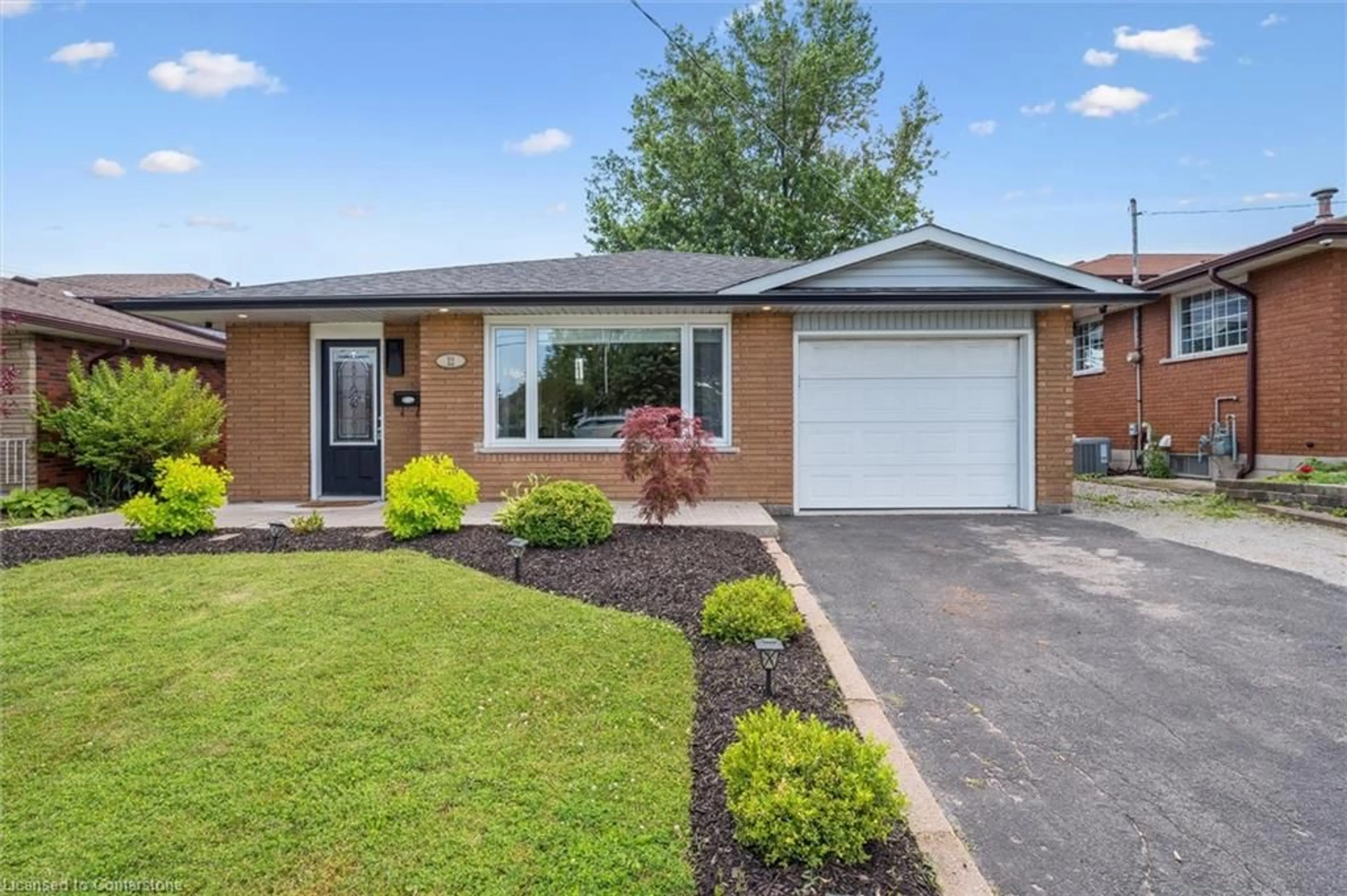 Home with brick exterior material, street for 12 Anson Ave, Hamilton Ontario L8T 2X3