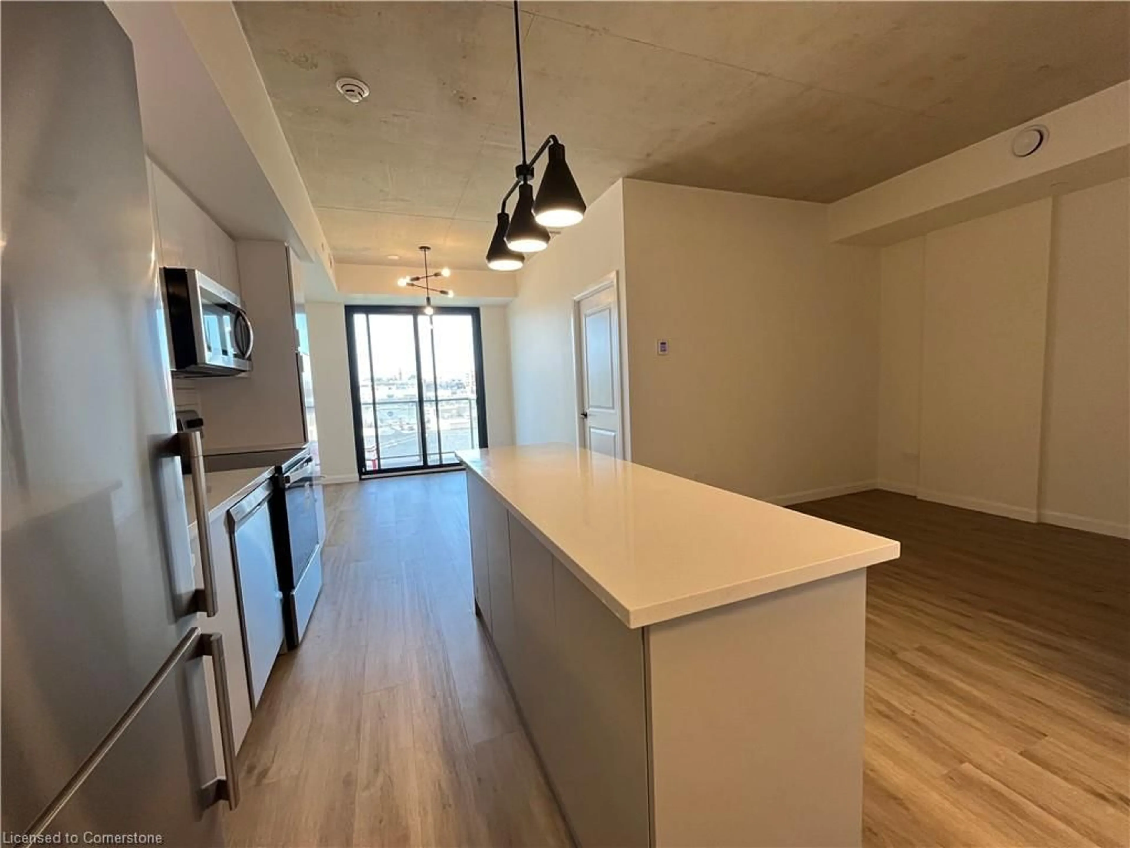 Open concept kitchen, wood/laminate floor for 7 Erie Ave #515, Brantford Ontario N3S 0K5