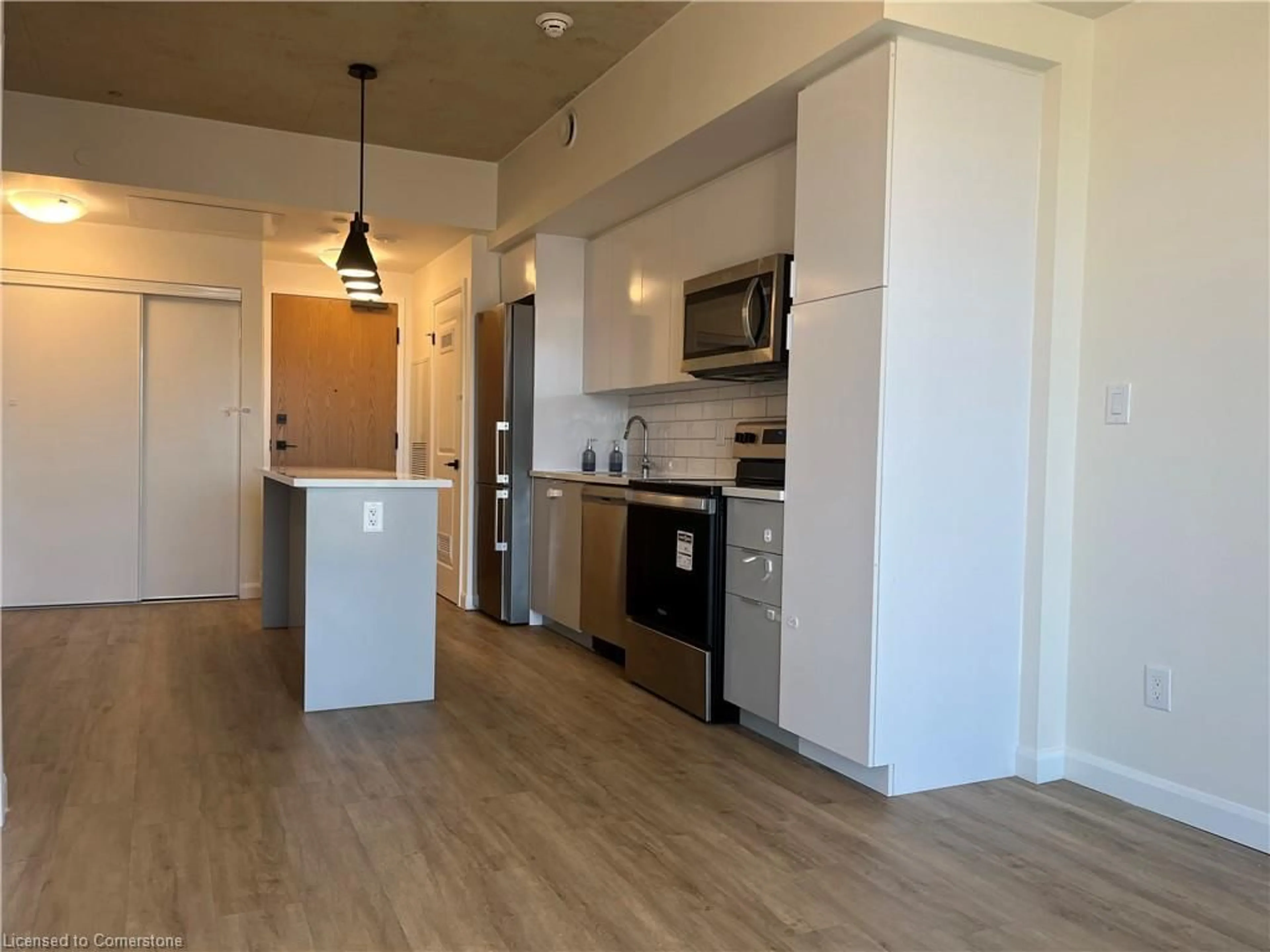 Open concept kitchen, wood/laminate floor for 7 Erie Ave #515, Brantford Ontario N3S 0K5