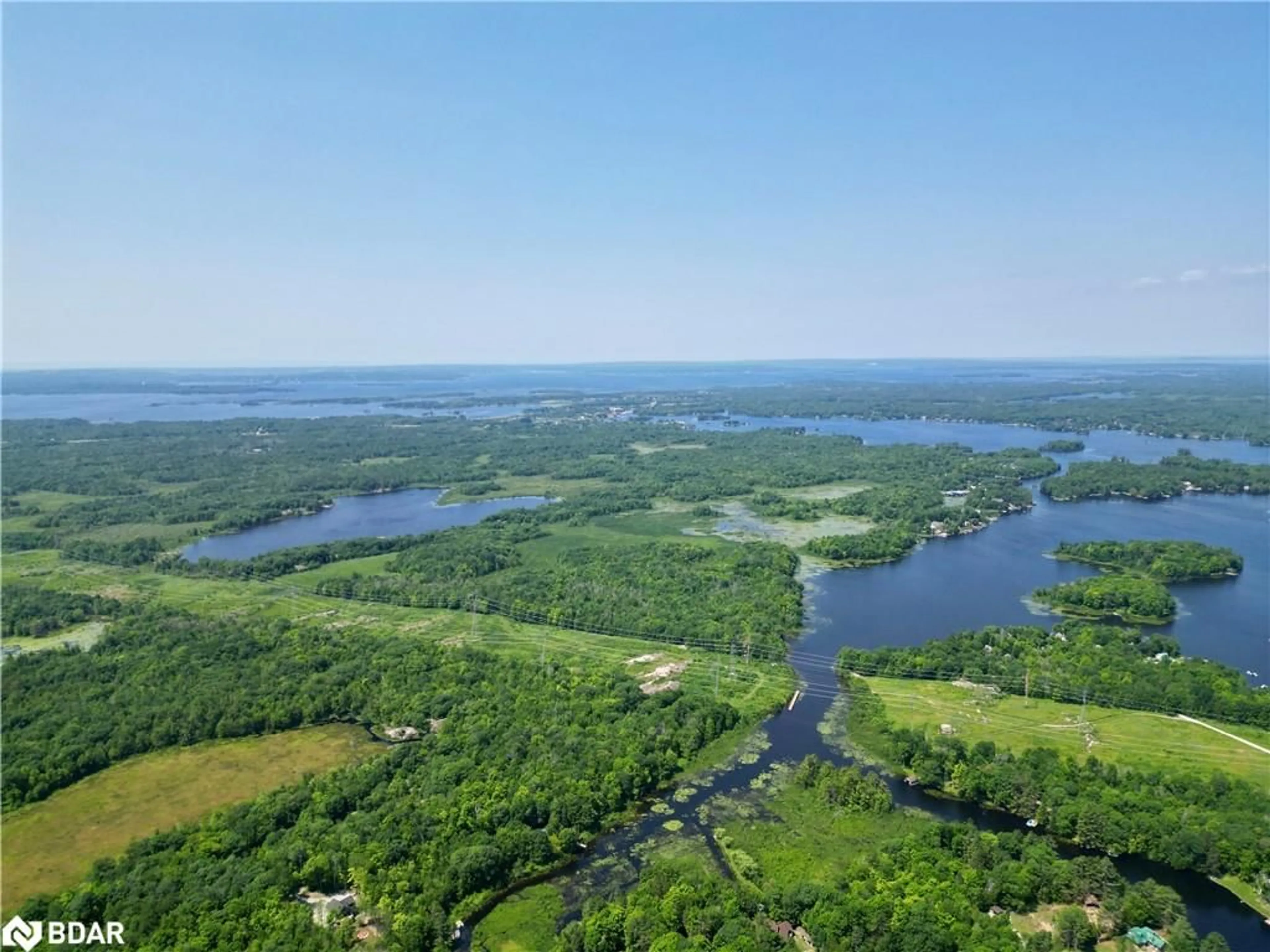 A pic from outside/outdoor area/front of a property/back of a property/a pic from drone, water/lake/river/ocean view for 1894 Henrys Landing Landng, Coldwater Ontario L0K 1E0