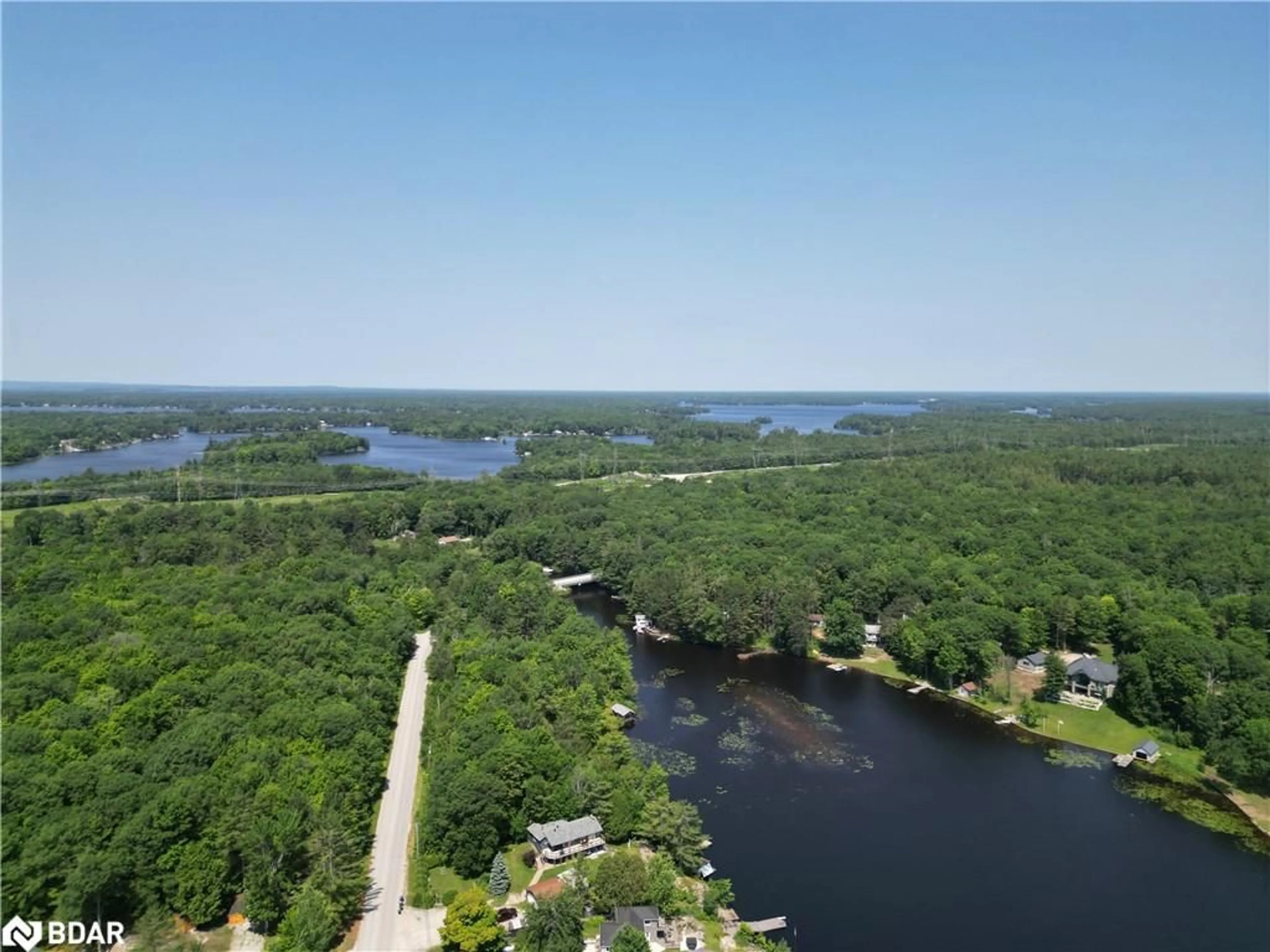 A pic from outside/outdoor area/front of a property/back of a property/a pic from drone, water/lake/river/ocean view for 1894 Henrys Landing Landng, Coldwater Ontario L0K 1E0