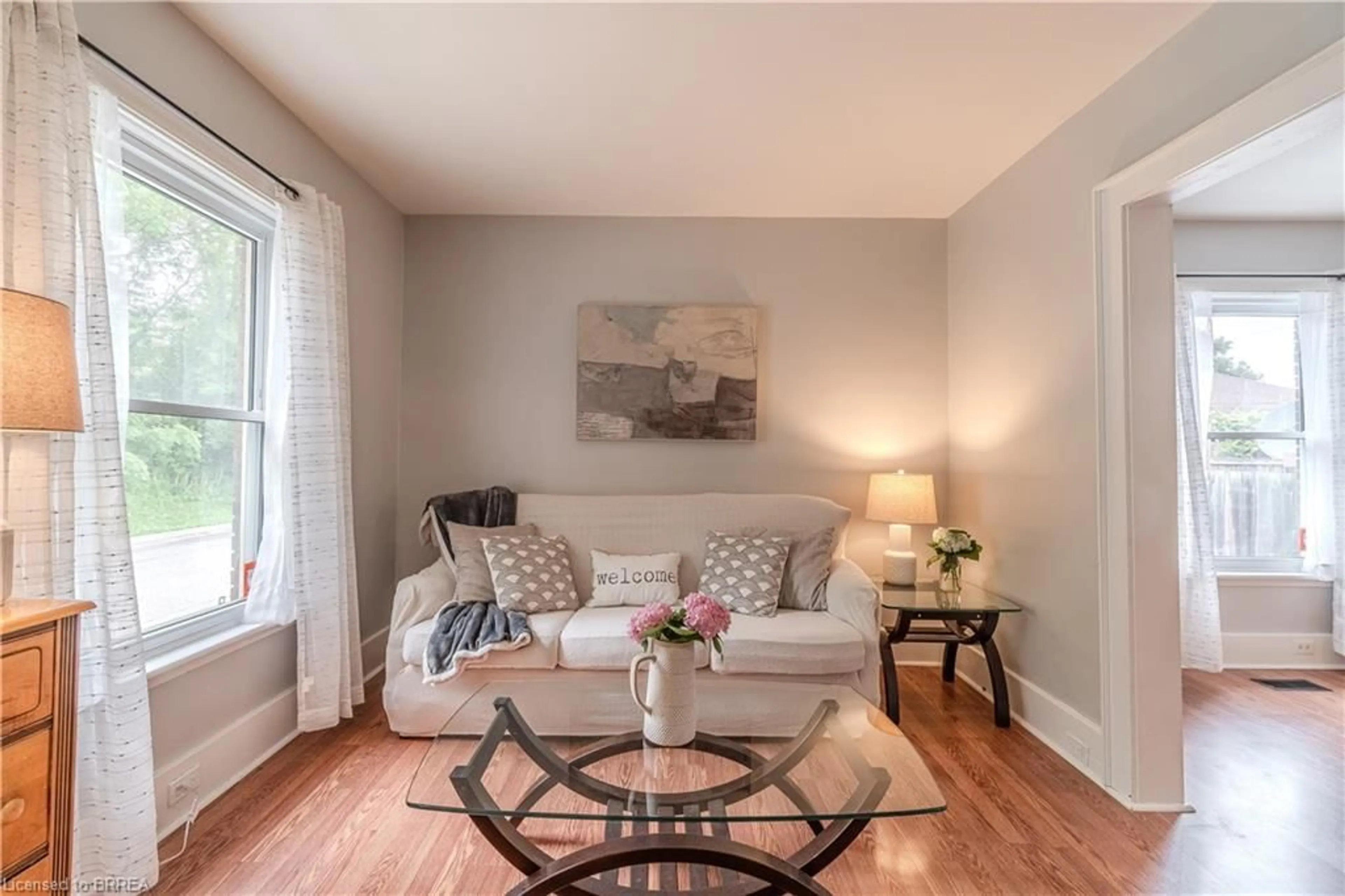 Living room with furniture, wood/laminate floor for 182 Durham St, Brantford Ontario N3S 4Y7