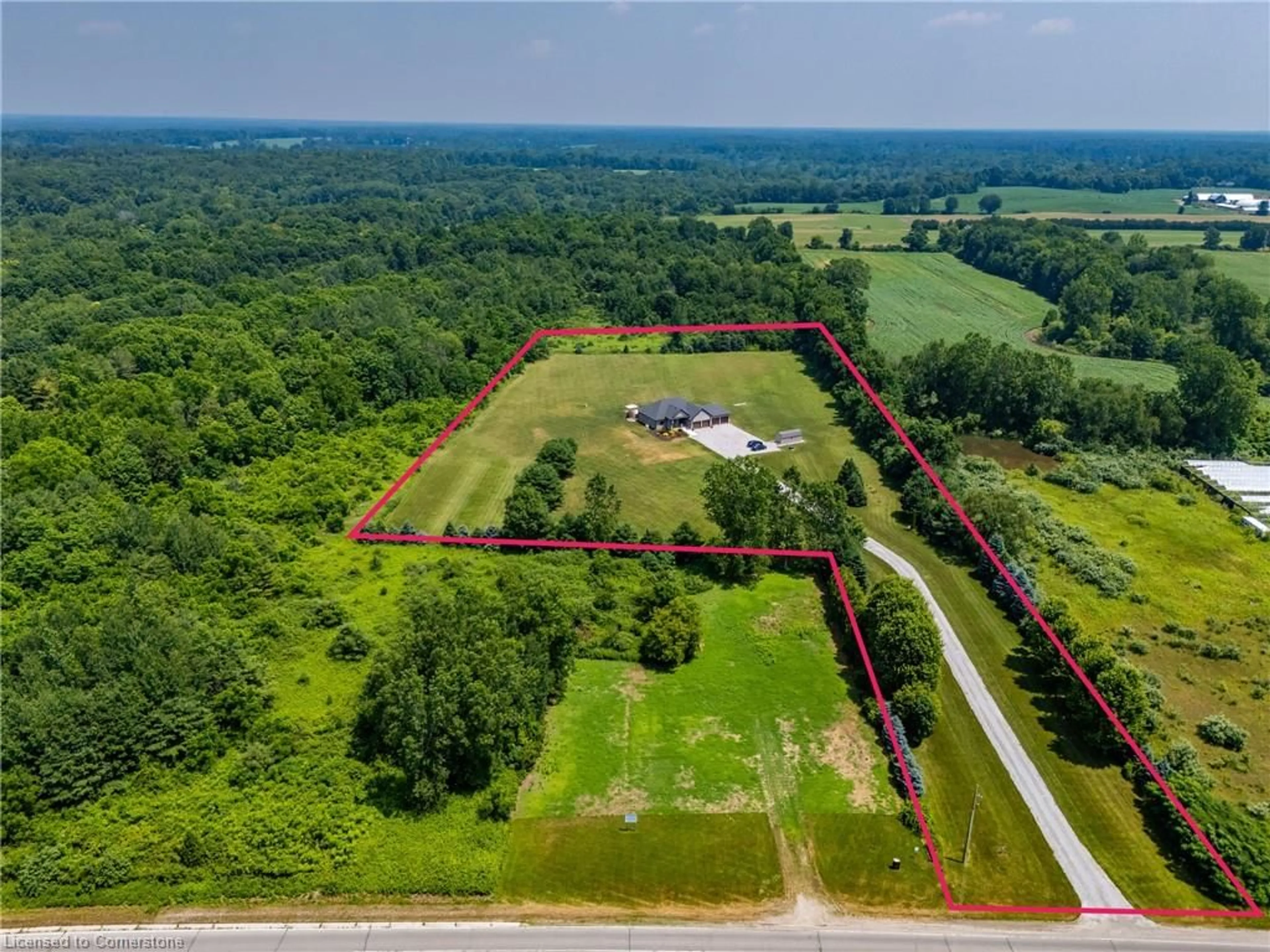 A pic from outside/outdoor area/front of a property/back of a property/a pic from drone, forest/trees view for 2554 Highway 59 Hwy, Langton Ontario N0E 1G0