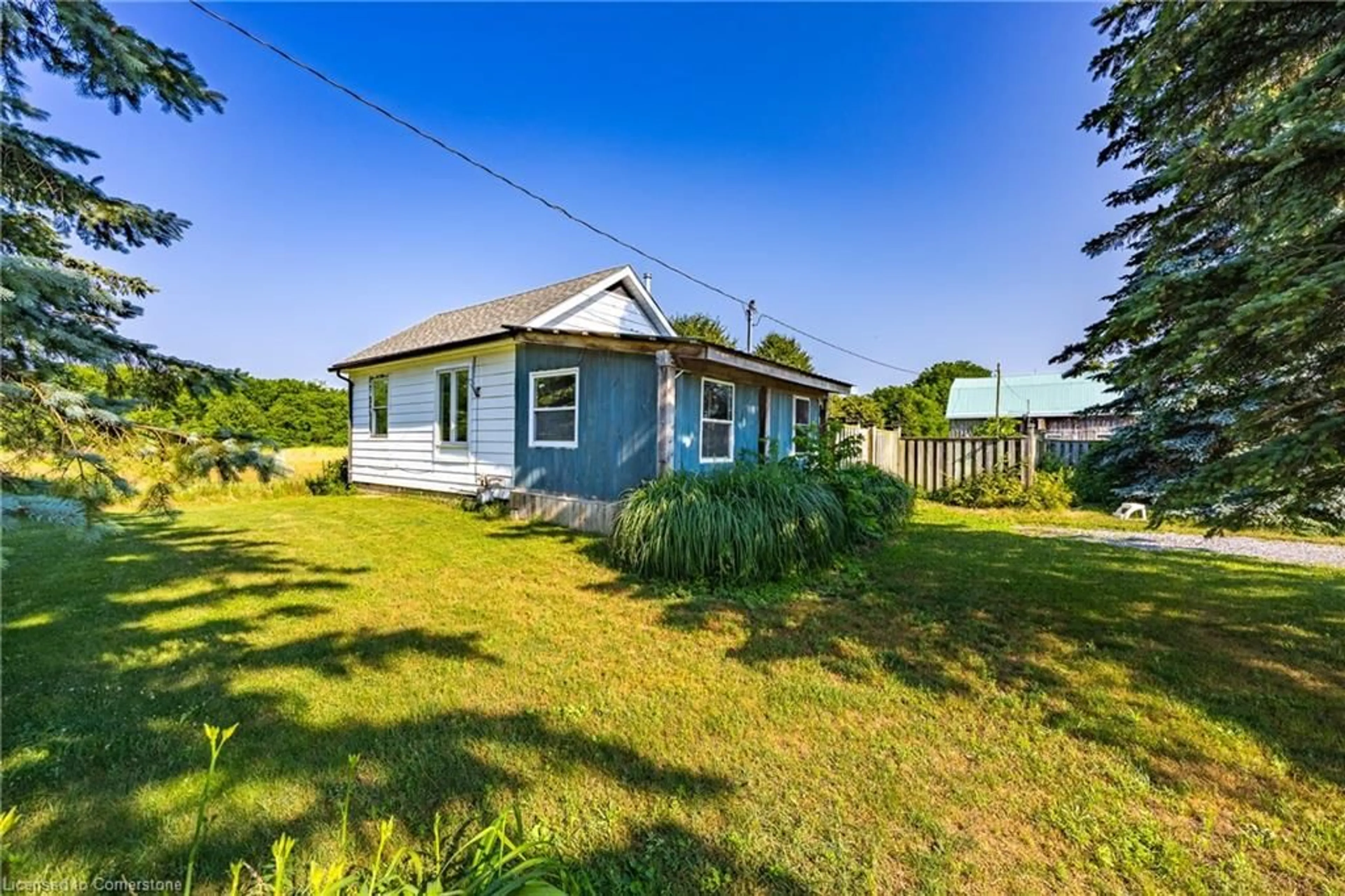 A pic from outside/outdoor area/front of a property/back of a property/a pic from drone, unknown for 895 Windham Road 11, Delhi Ontario N4B 2W5