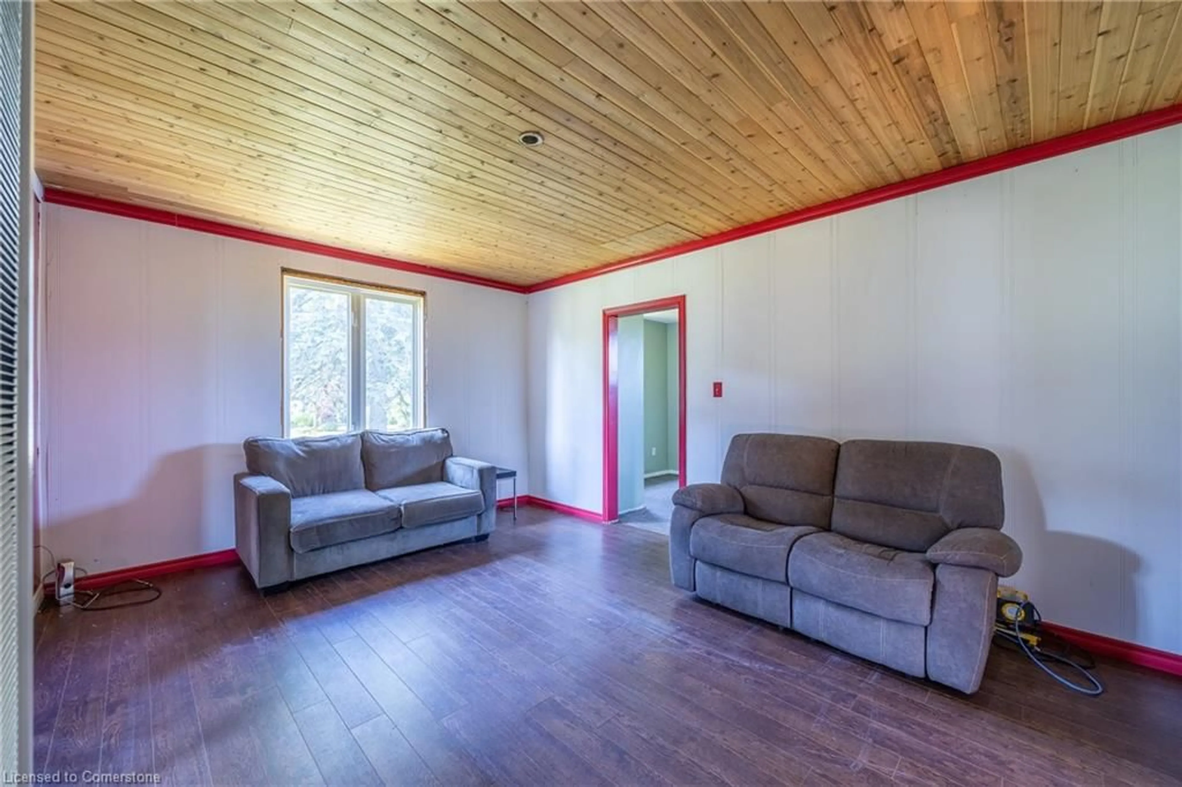 Living room with furniture, wood/laminate floor for 895 Windham Road 11, Delhi Ontario N4B 2W5