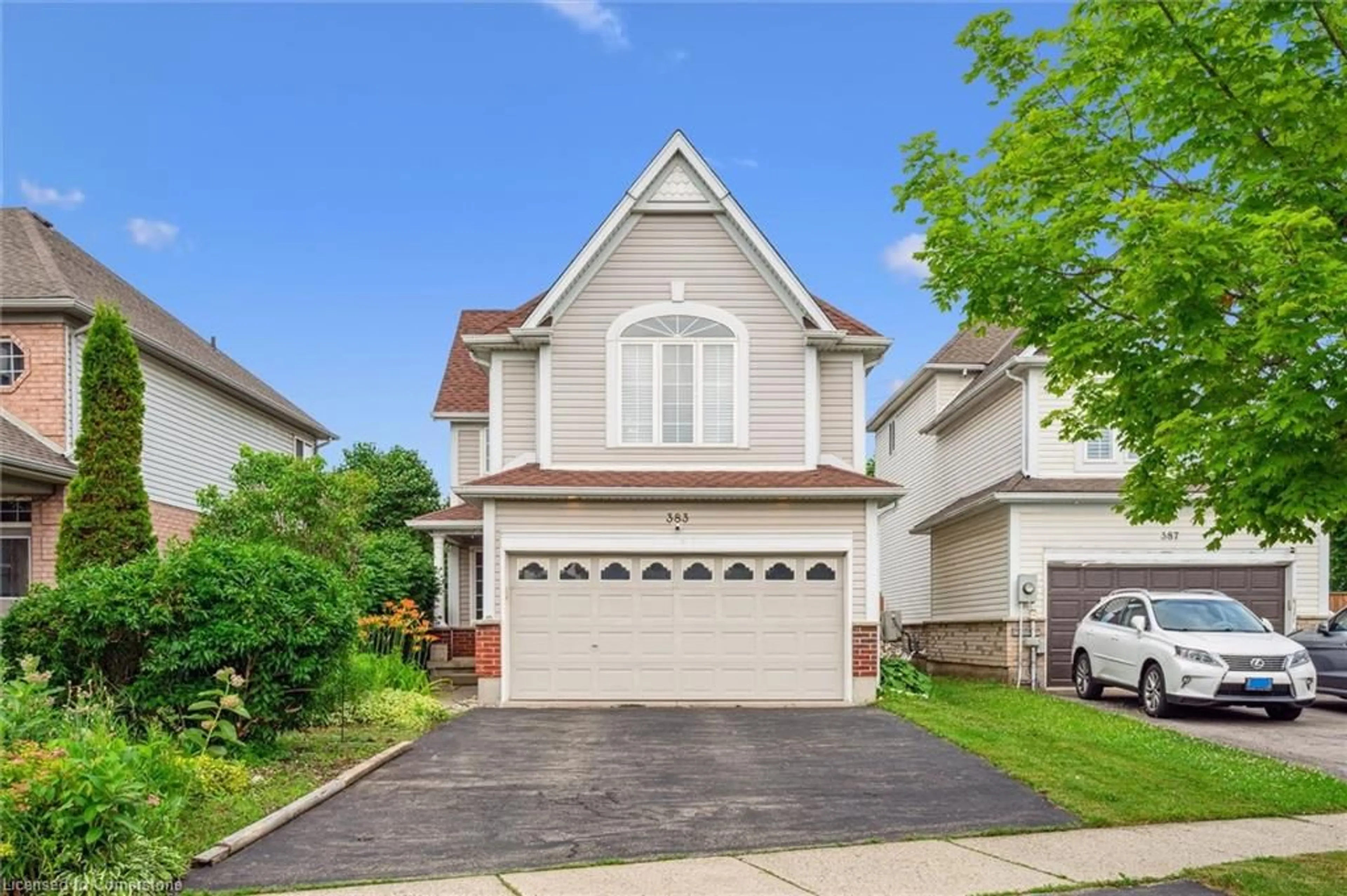 Home with vinyl exterior material, street for 383 Beaver Creek Rd, Waterloo Ontario N2T 2T2