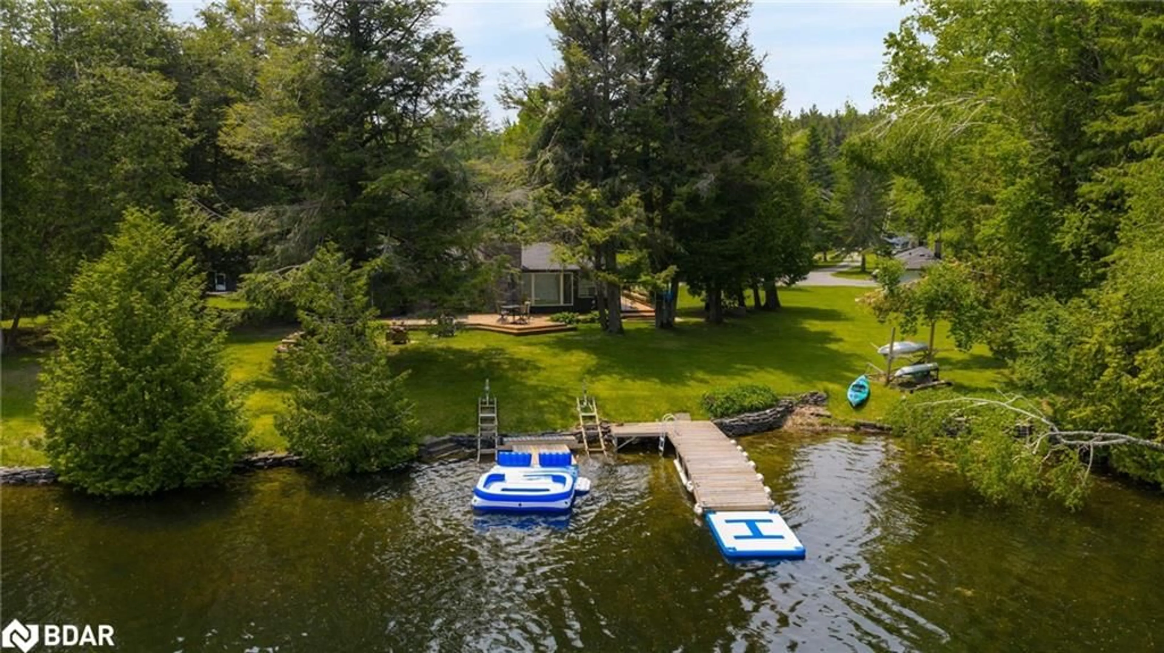 A pic from outside/outdoor area/front of a property/back of a property/a pic from drone, water/lake/river/ocean view for 22 Cardinal Dr, Woodville Ontario K0M 2T0