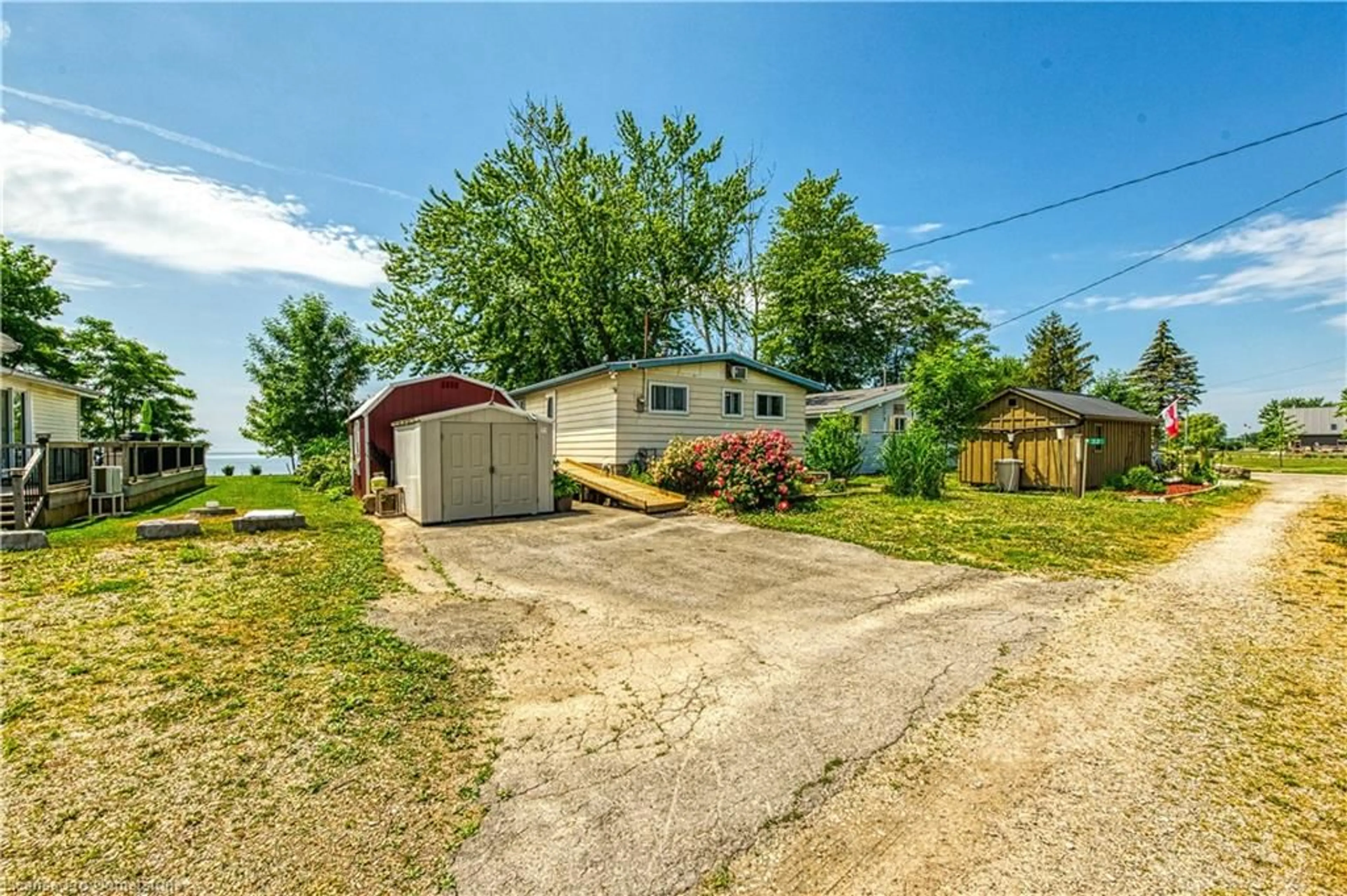 A pic from outside/outdoor area/front of a property/back of a property/a pic from drone, street for 32 Warnick Rd, Lowbanks Ontario N0A 1K0