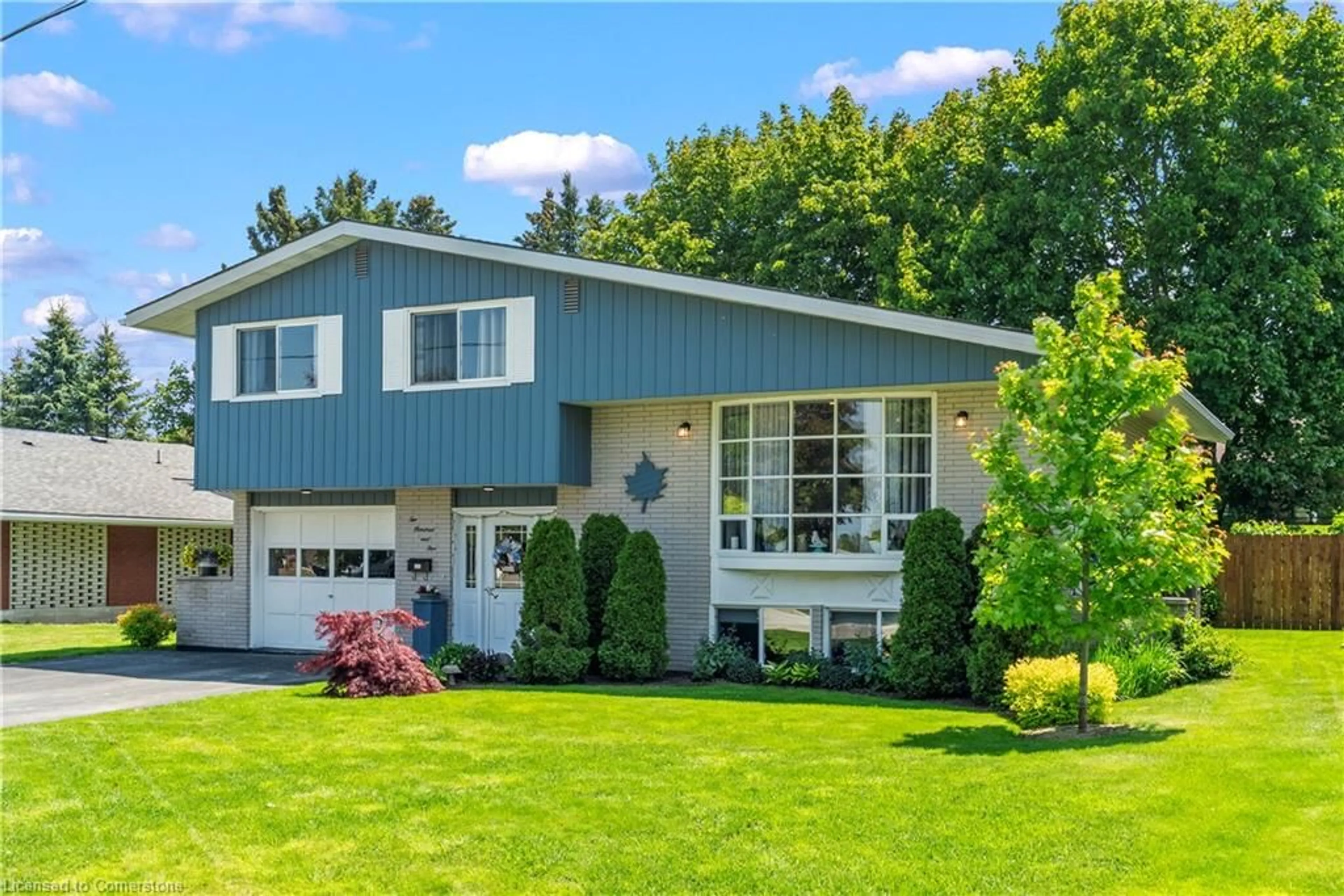 Home with vinyl exterior material, street for 205 Byeland Dr, Mount Forest Ontario N0G 2L2