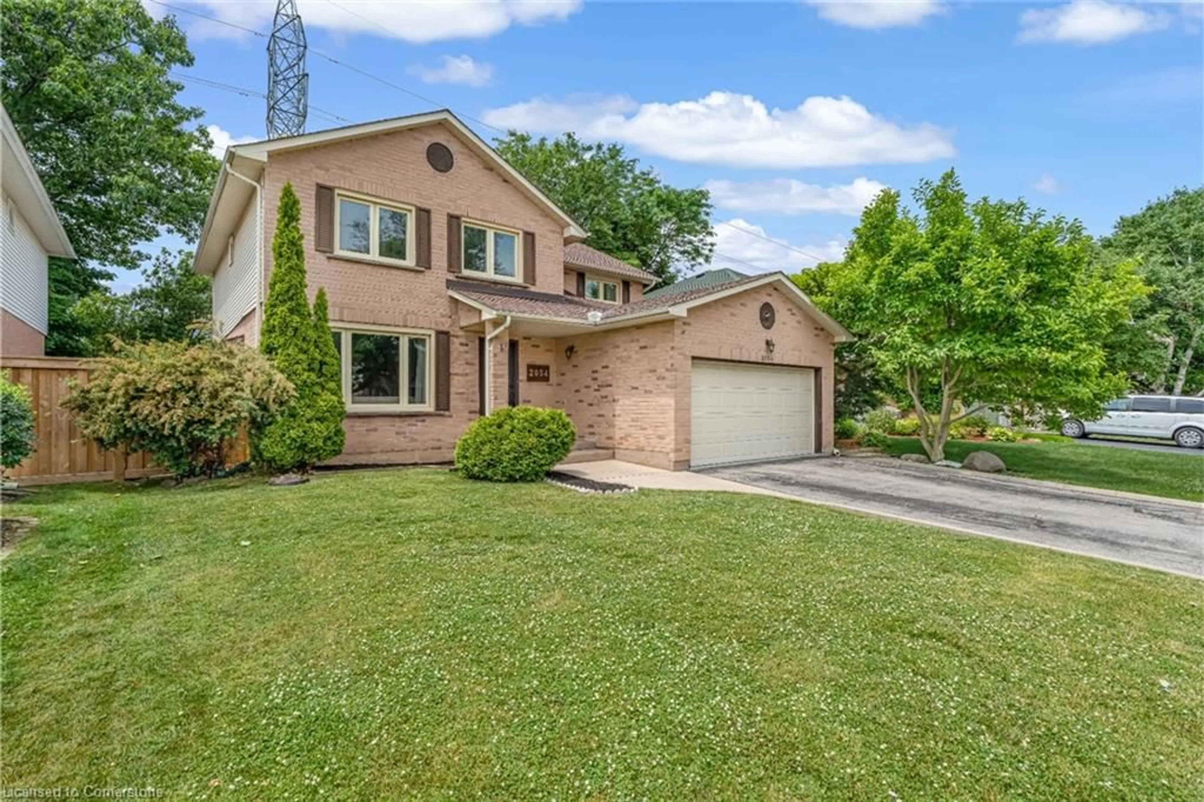Home with brick exterior material, street for 2054 Hunters Wood Dr, Burlington Ontario L7M 2V1
