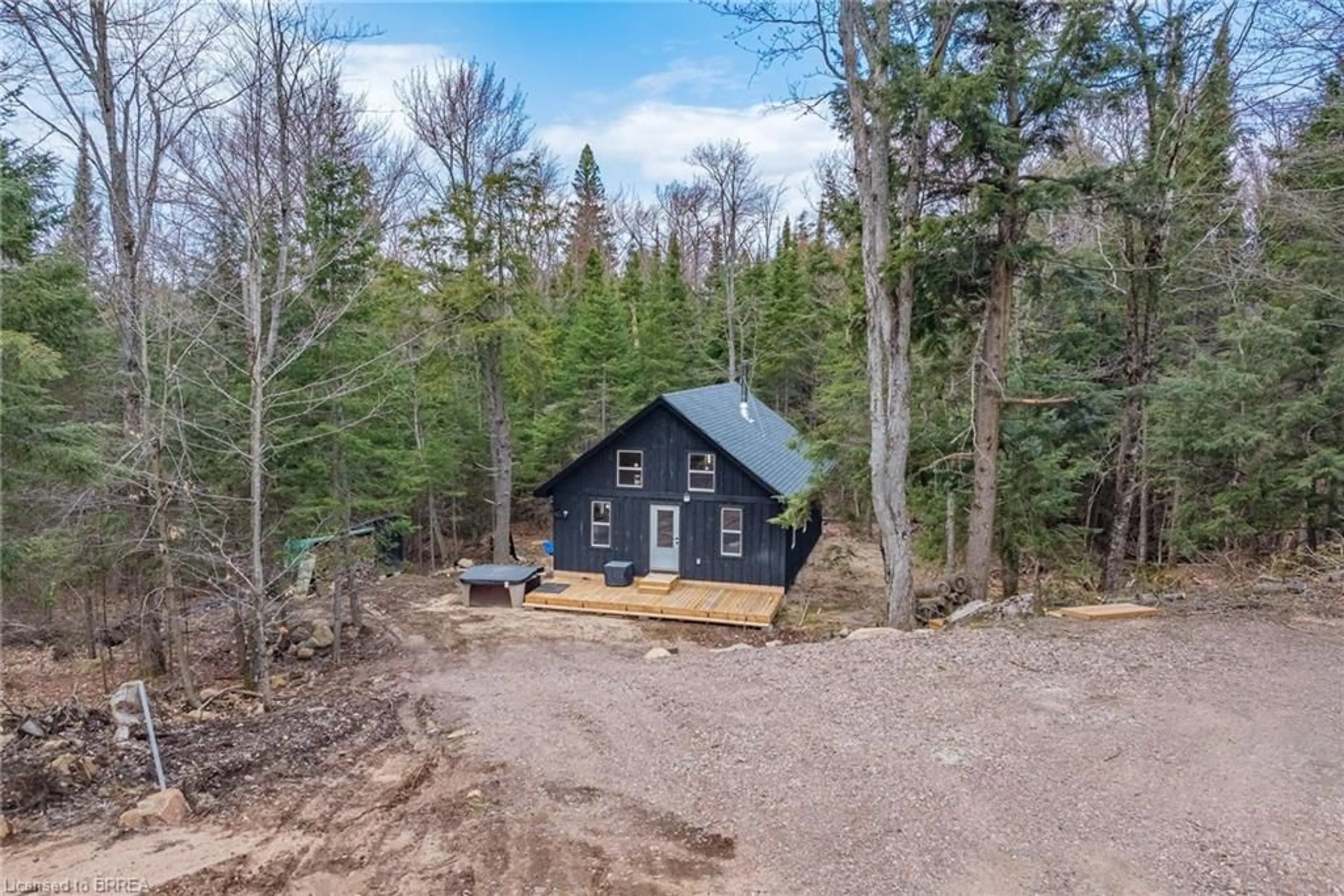 A pic from outside/outdoor area/front of a property/back of a property/a pic from drone, forest/trees view for 1820 Riding Ranch Rd, South River Ontario Z1Z 1Z1