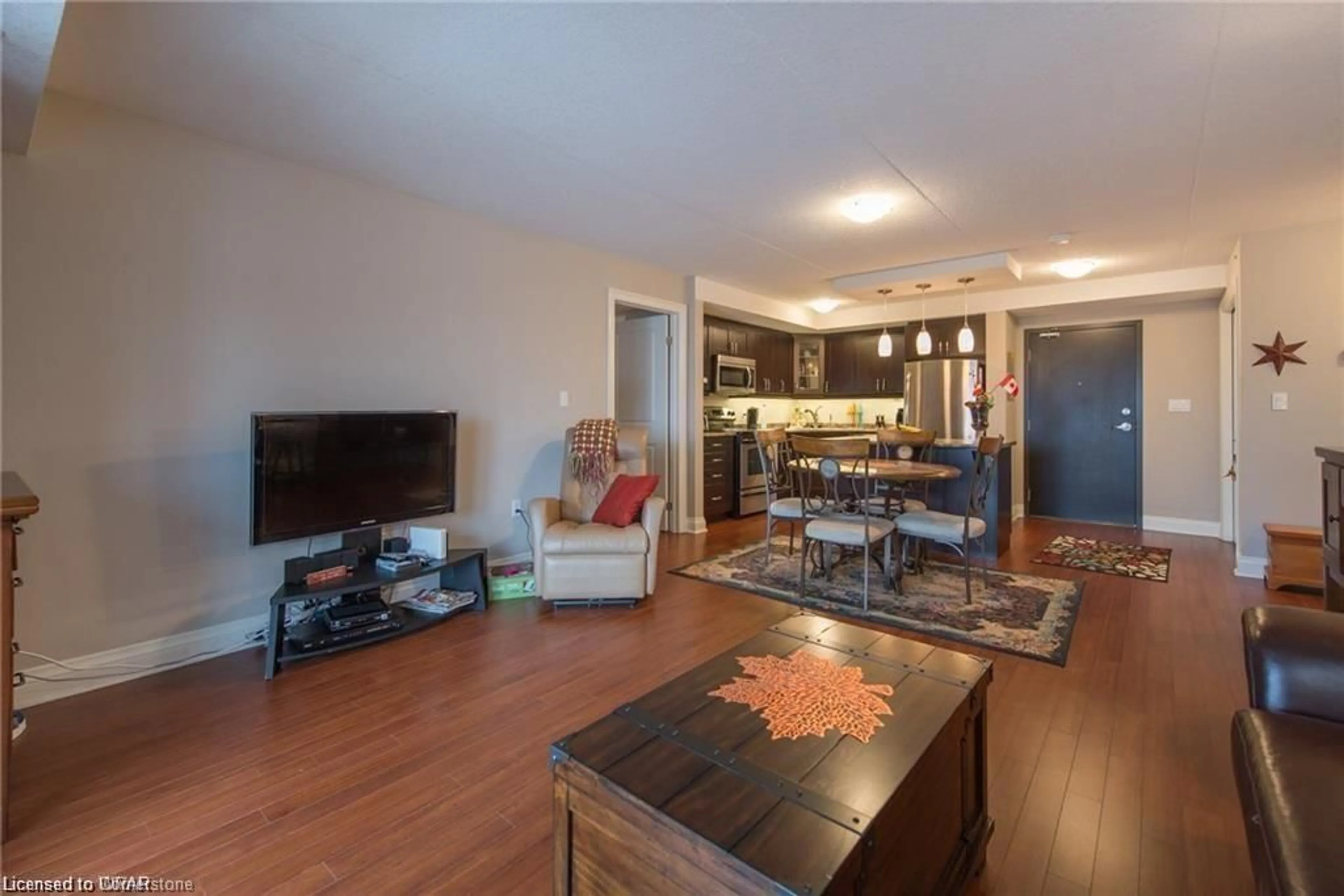 Living room with furniture, wood/laminate floor for 776 Laurelwood Dr #509, Waterloo Ontario N2V 0A8